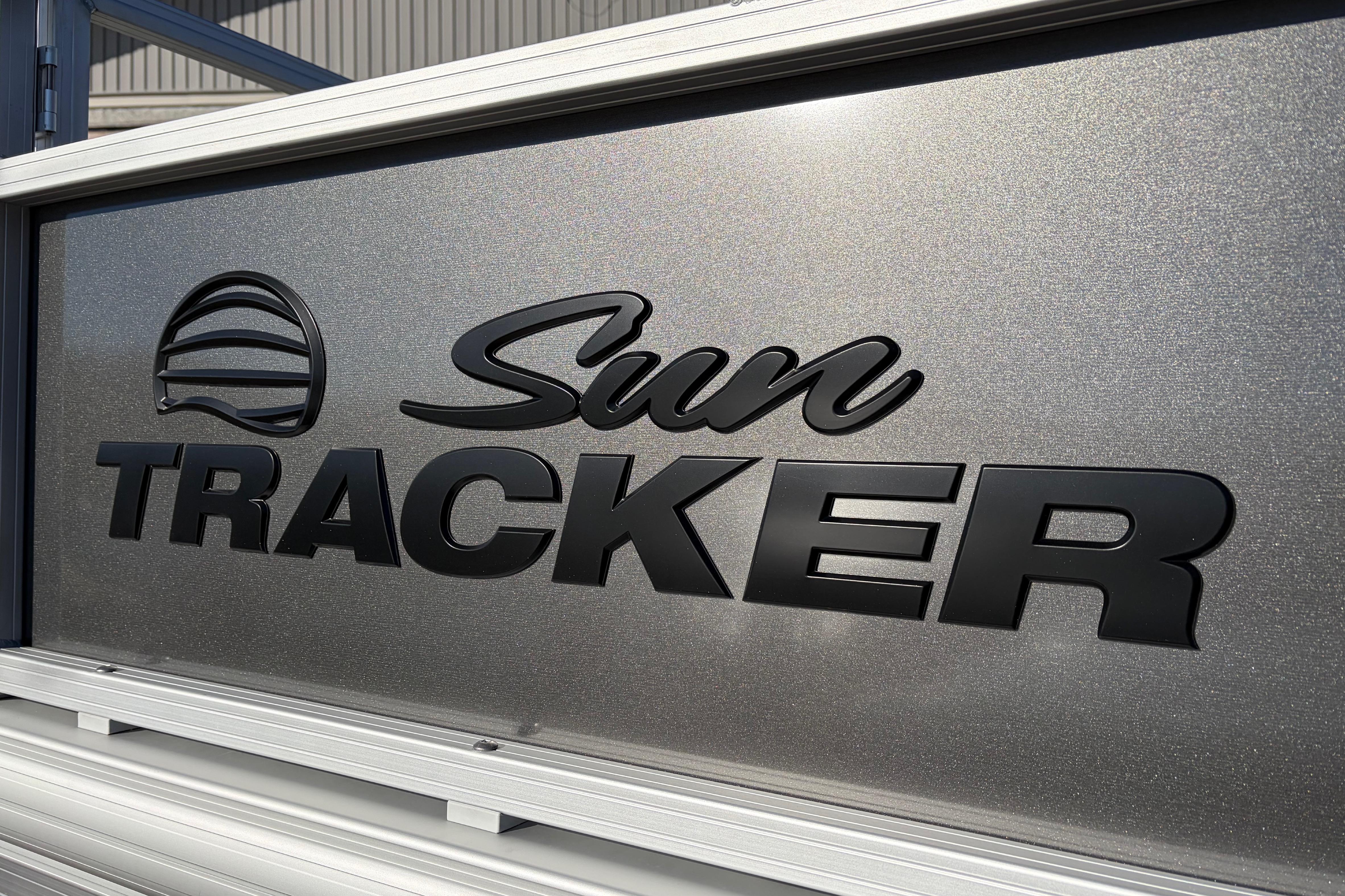 Sun Tracker Bass Buggy 18 DLX 2026 logo on metallic surface.