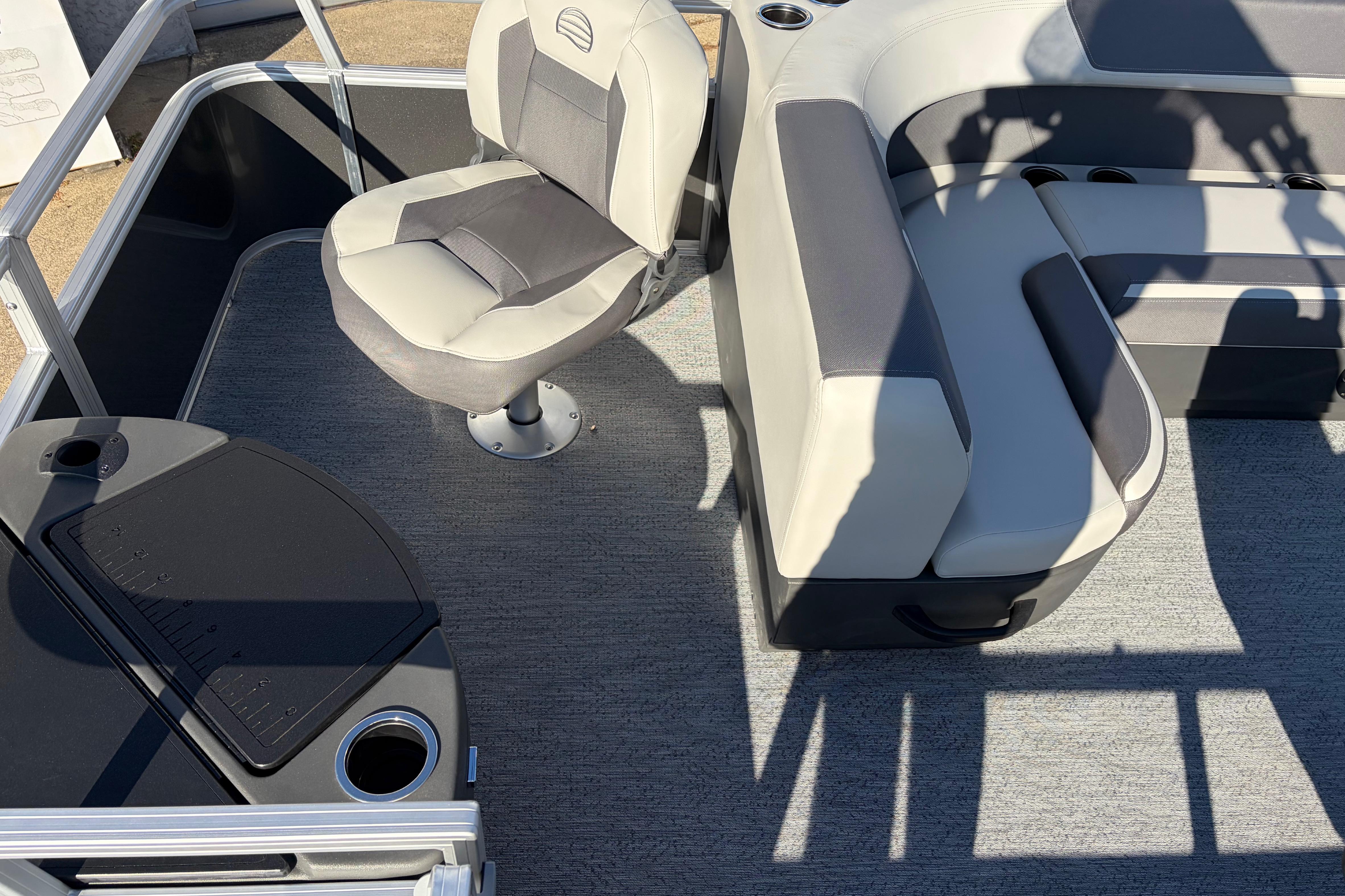 2026 Sun Tracker Bass Buggy 18 DLX interior with seating and fishing station.