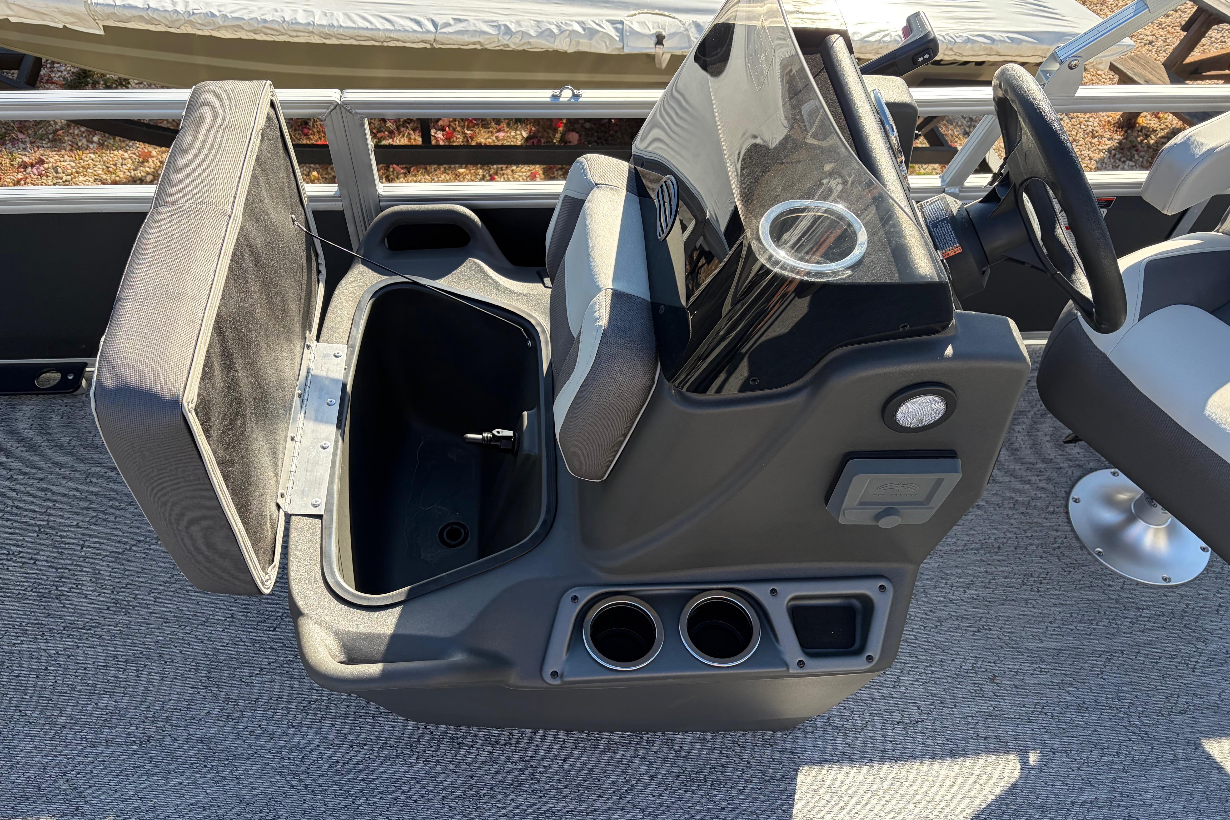 2026 Sun Tracker Bass Buggy 18 DLX boat console with open storage compartment.