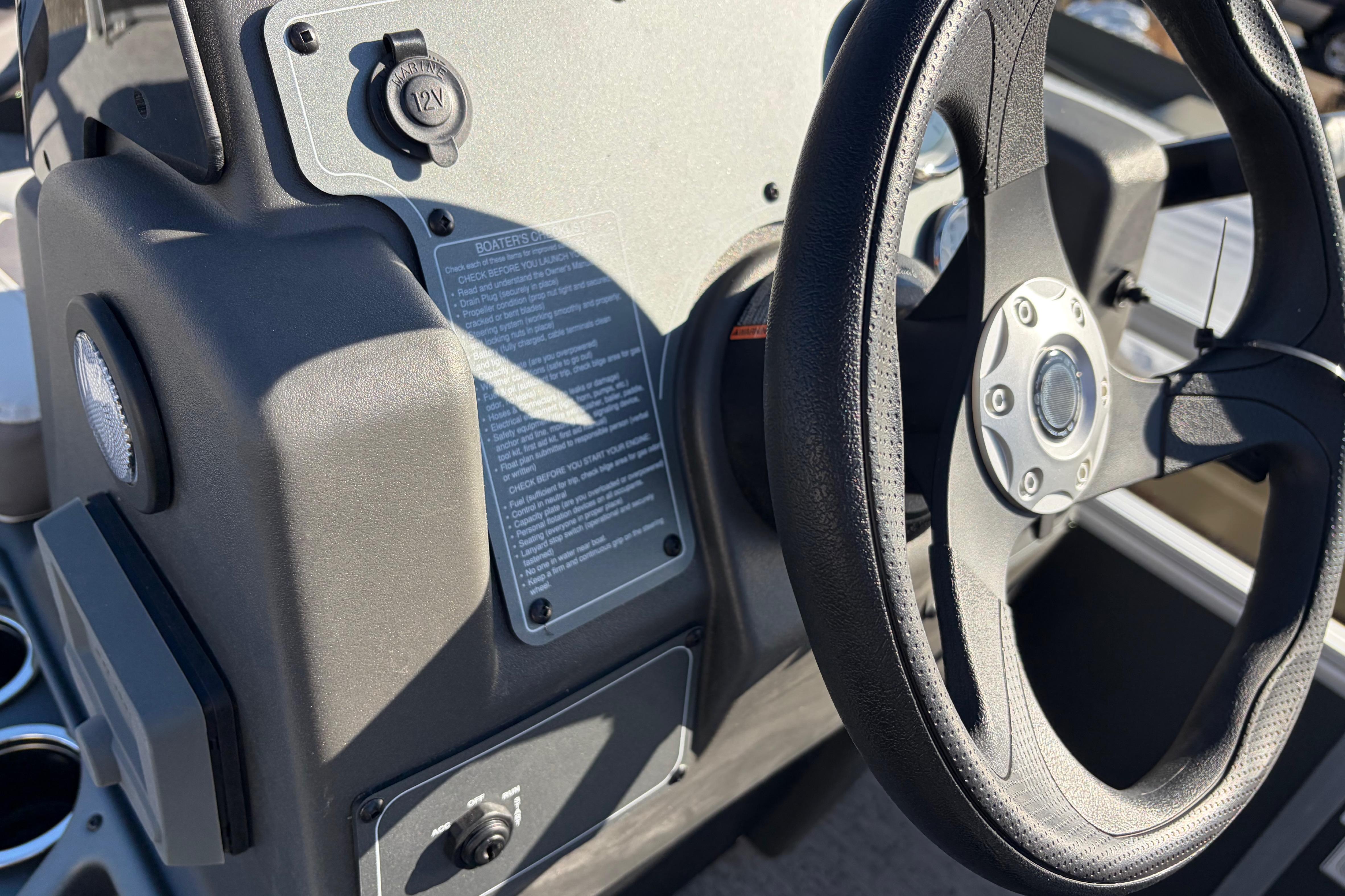Steering wheel and dashboard of 2026 Sun Tracker Bass Buggy 18 DLX boat.