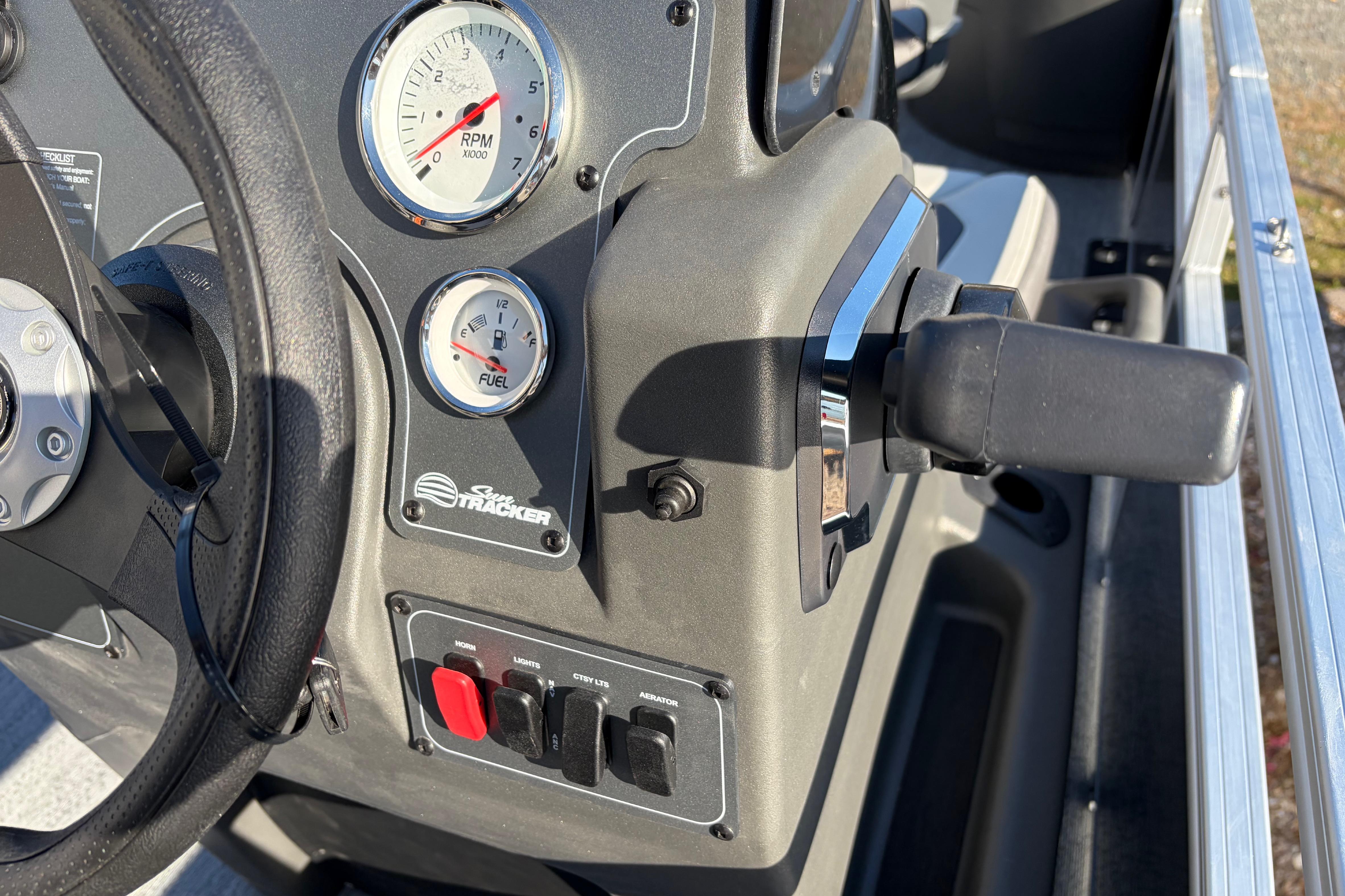 Dashboard of 2026 Sun Tracker Bass Buggy 18 DLX with RPM and fuel gauges.