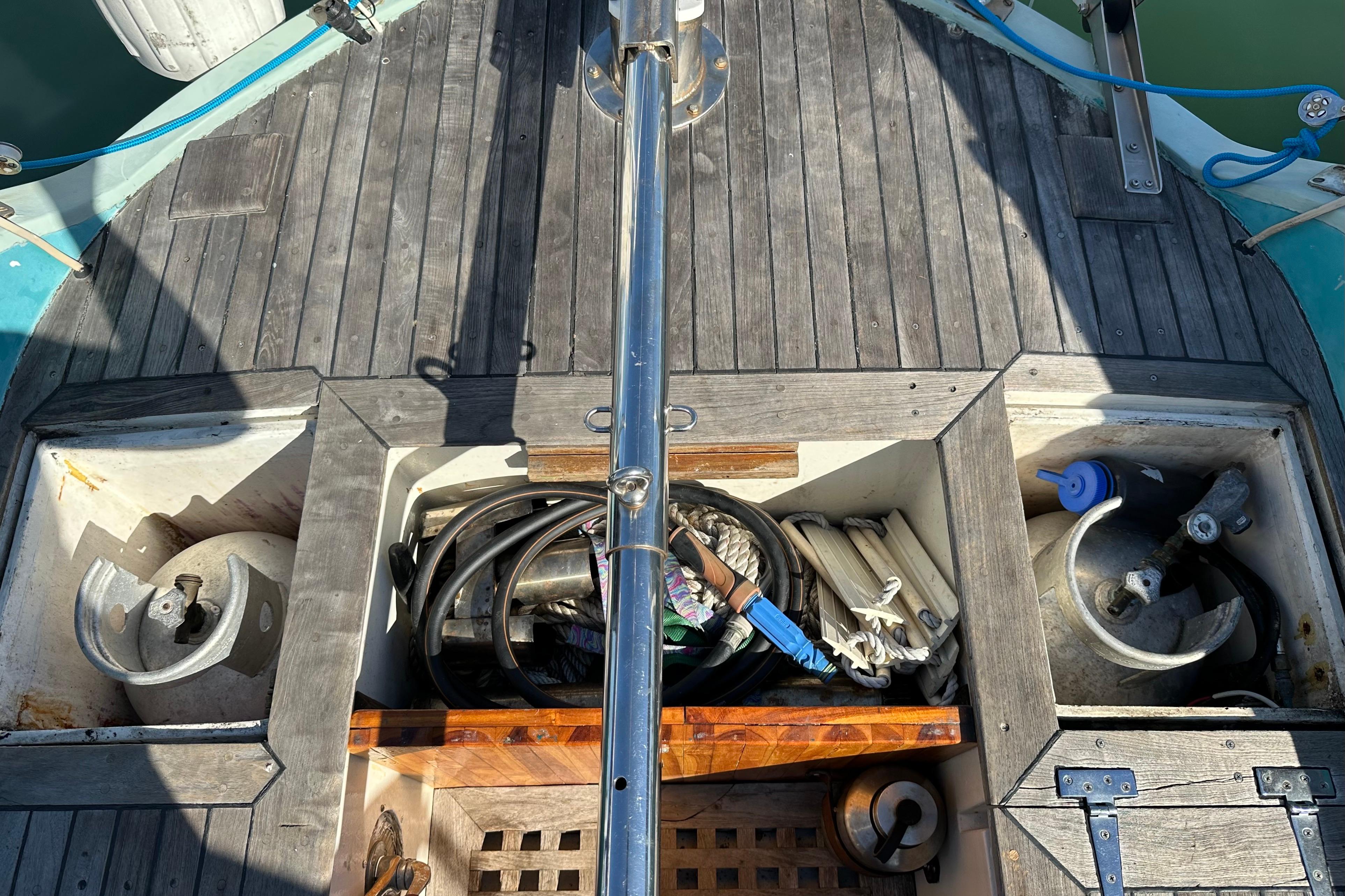 1978 Tayana 37 sailboat deck with storage compartments and nautical equipment.