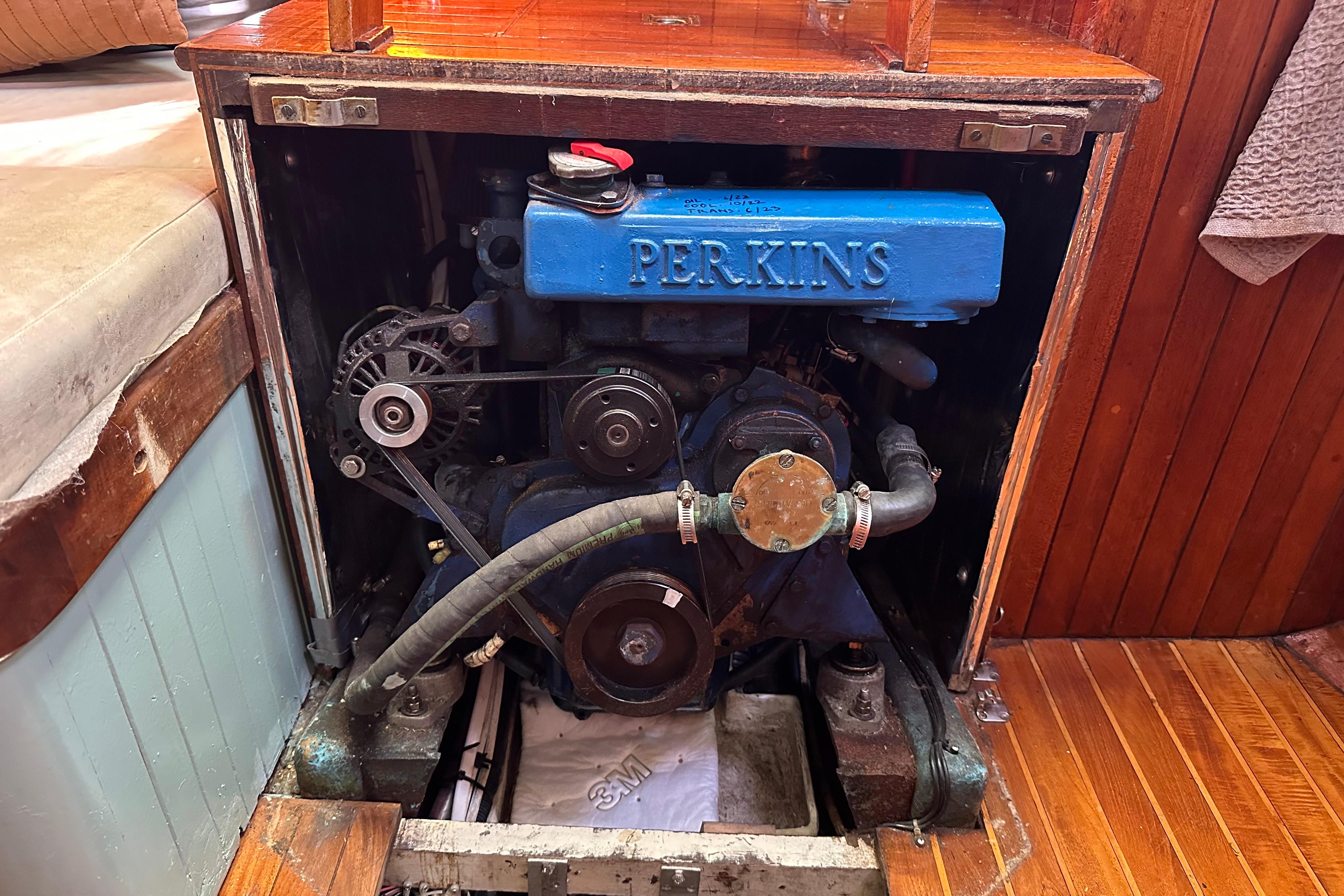Perkins engine inside 1978 Tayana 37 sailboat, showcasing marine engineering.