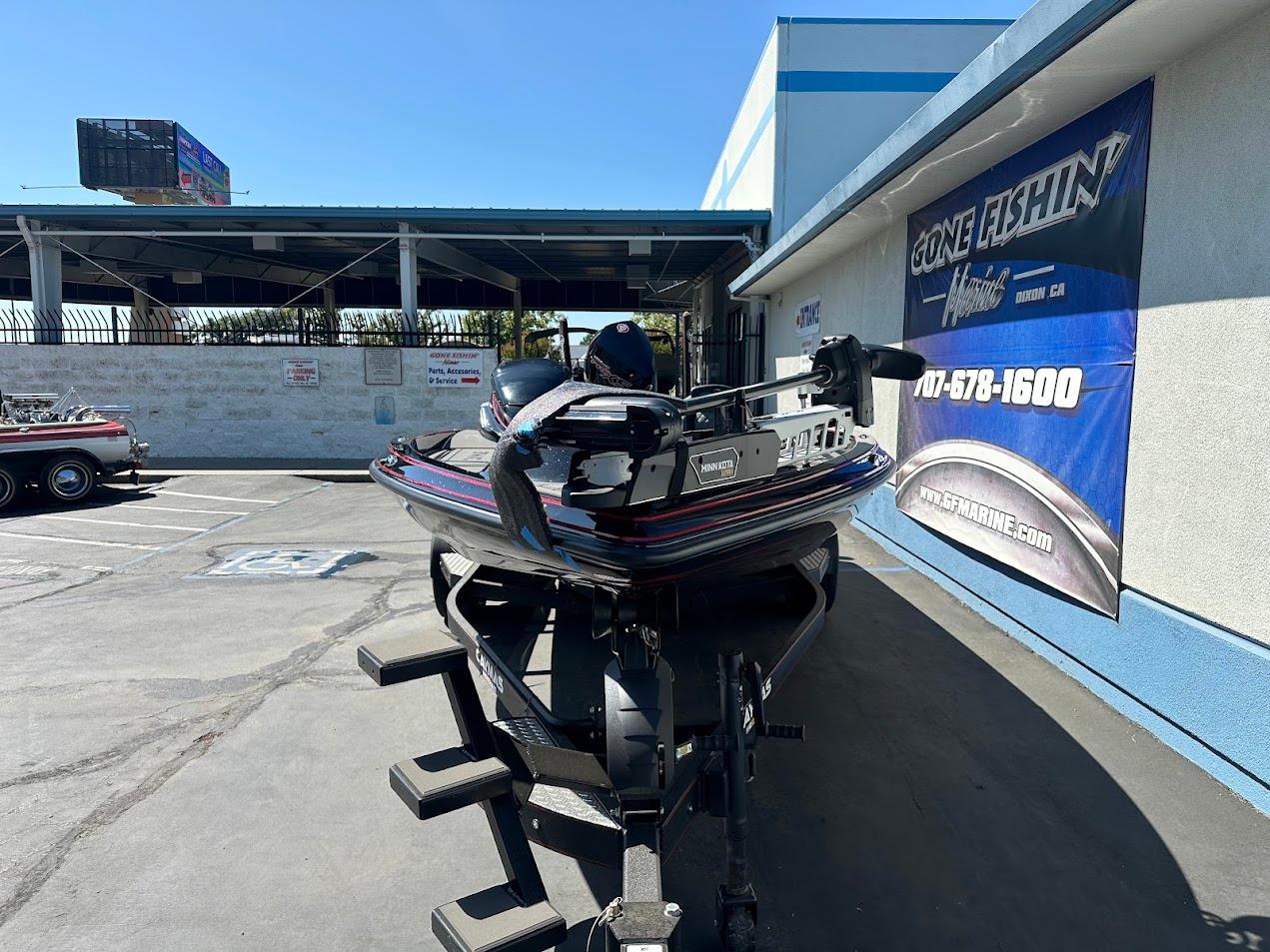 2024 Caymas XS 20 boat on trailer at dealership, outdoor display.