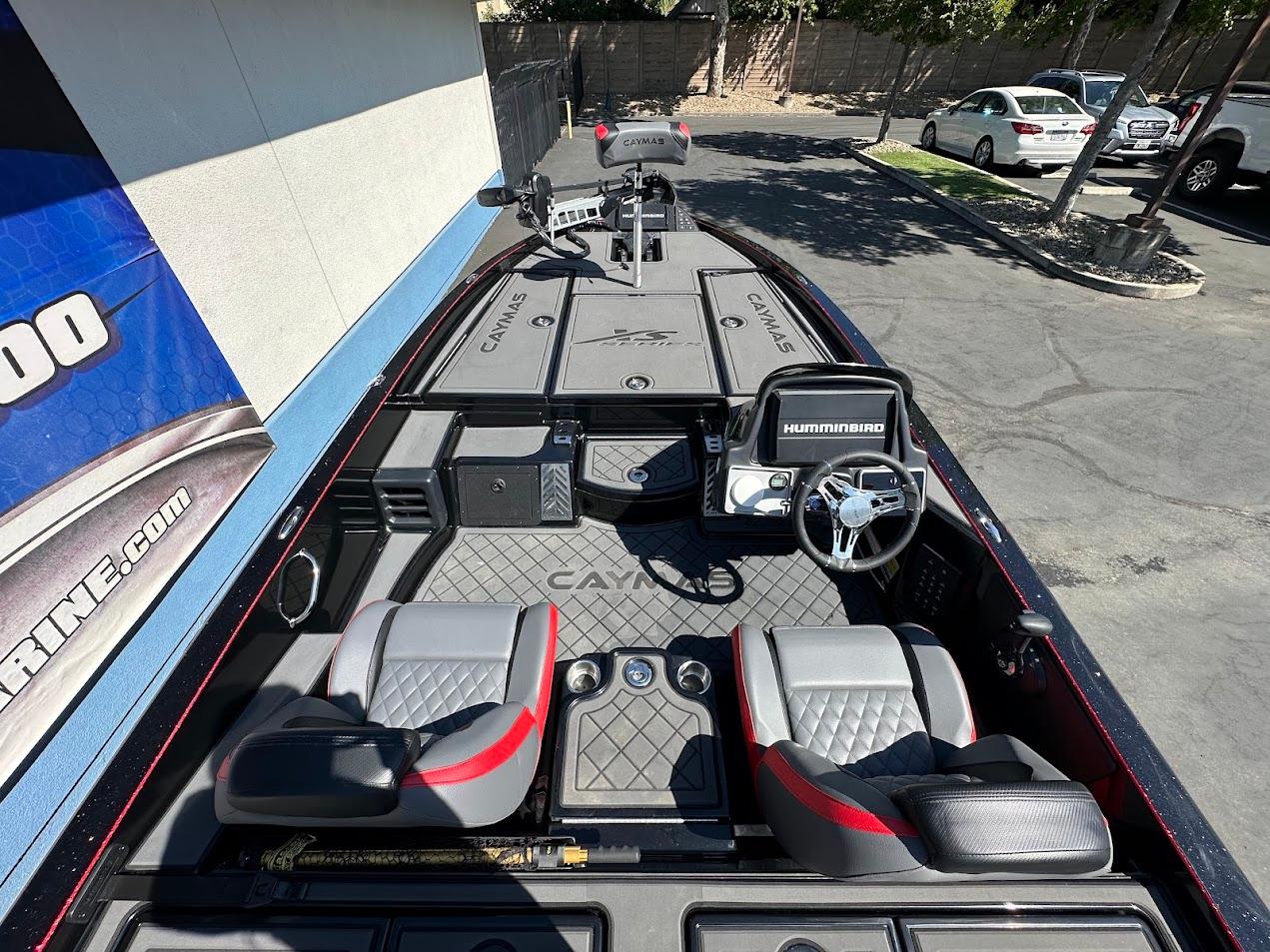 2024 Caymas XS 20 boat interior with steering wheel and seating, featuring Humminbird electronics.