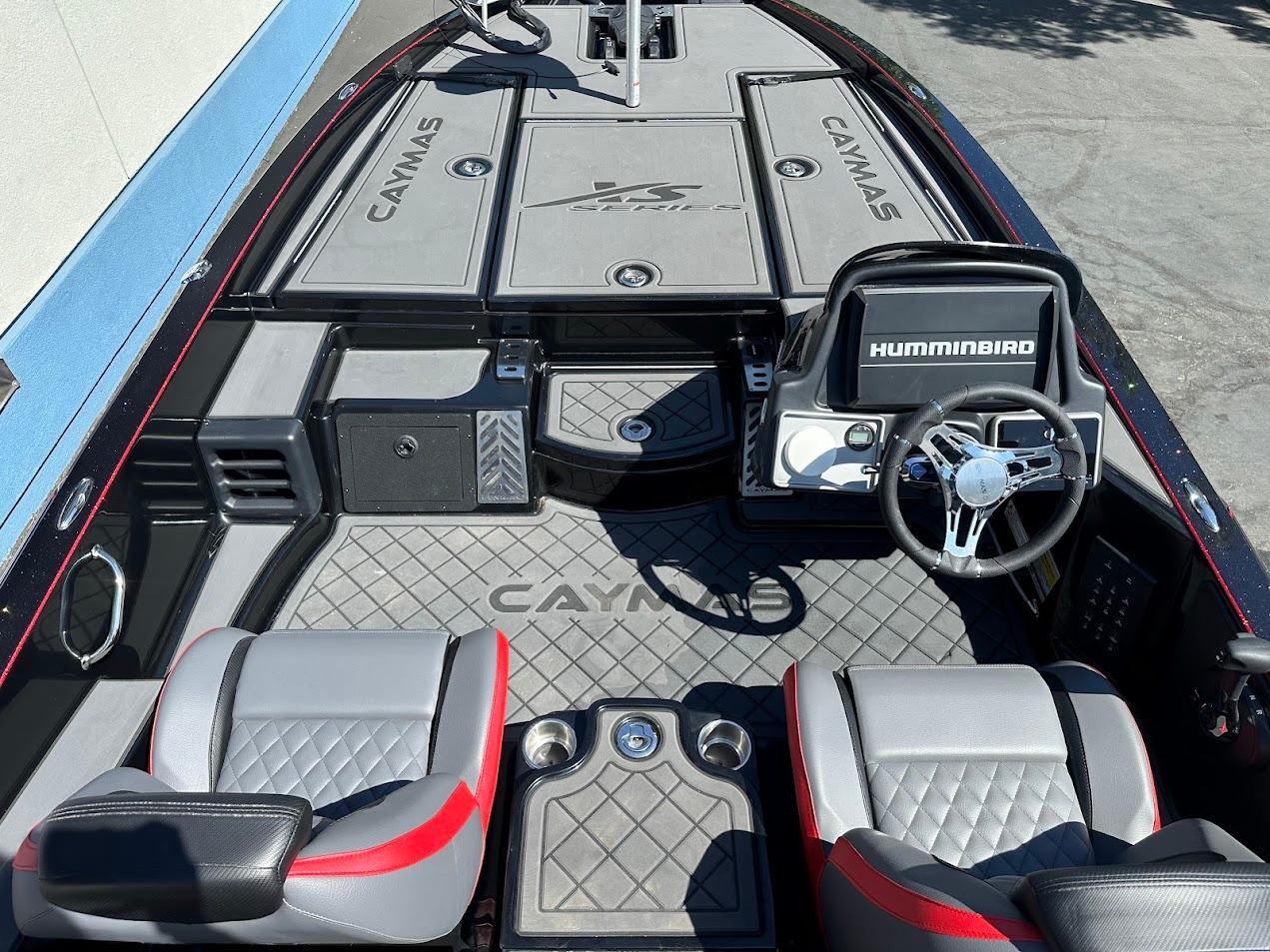 2024 Caymas XS 20 boat interior with steering wheel, seats, and Humminbird electronics.