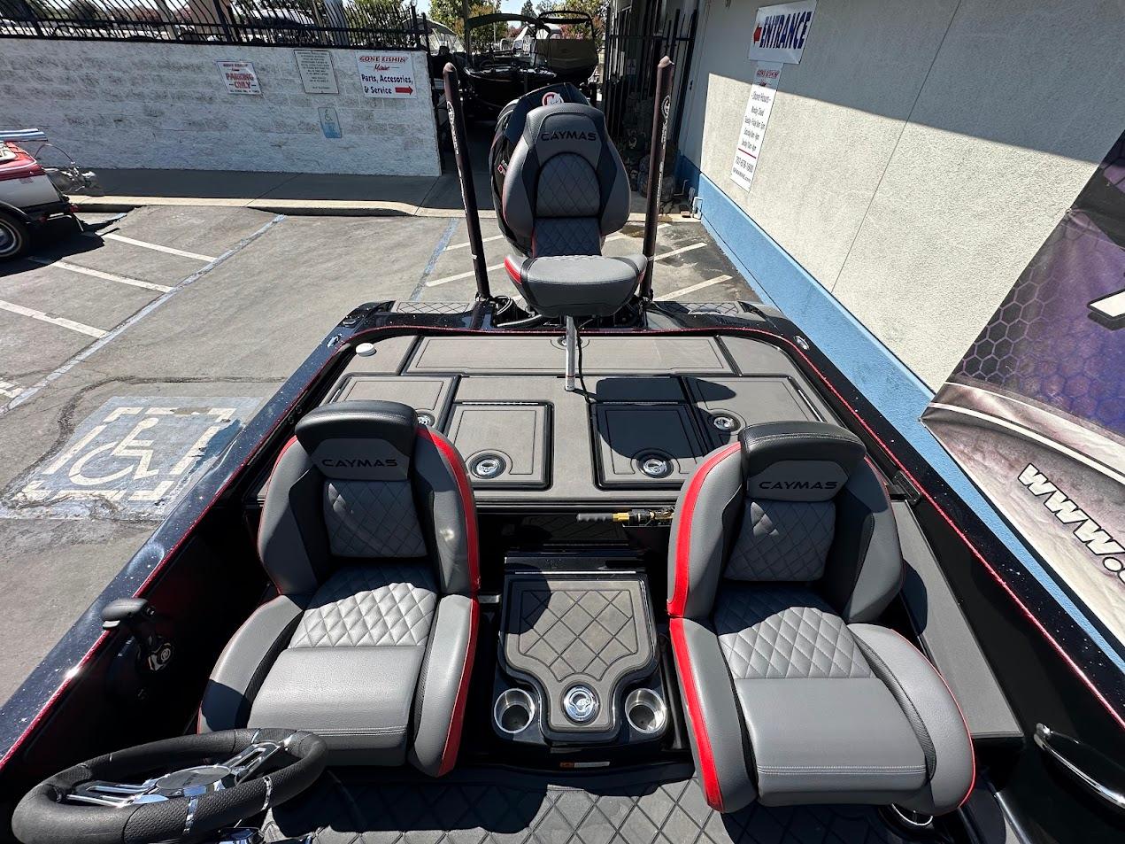 2024 Caymas XS 20 boat interior with dual seats and storage compartments.