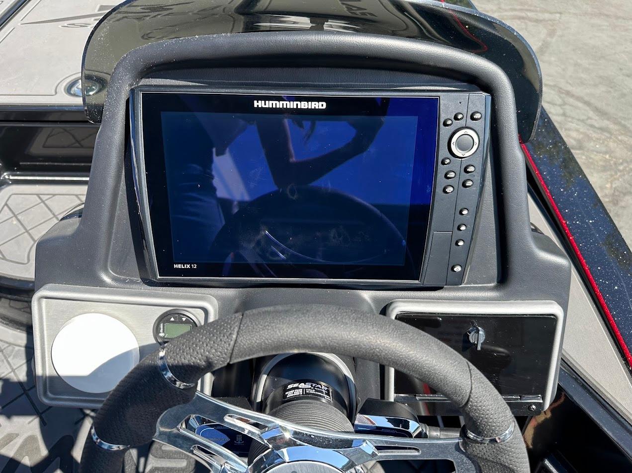 2024 Caymas XS 20 dashboard featuring Humminbird Helix 12 fishfinder and steering wheel.