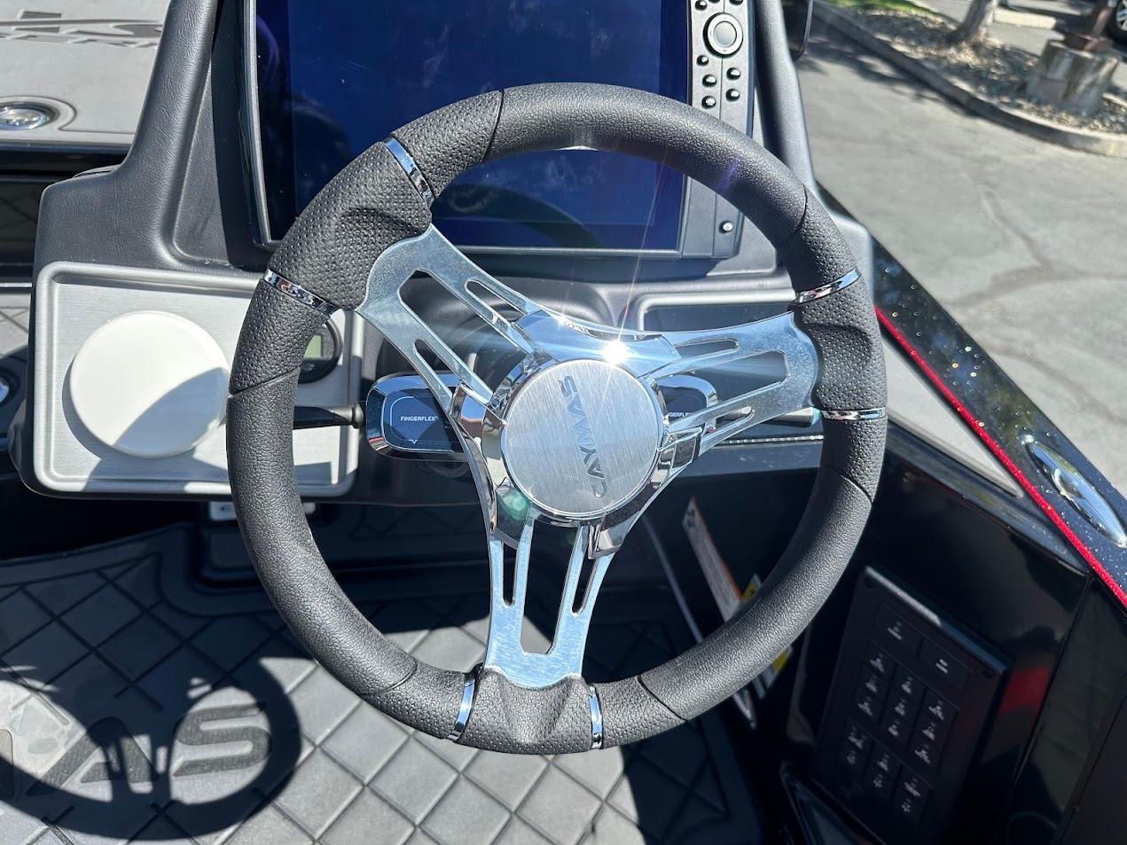Steering wheel of 2024 Caymas XS 20 boat with modern dashboard controls.
