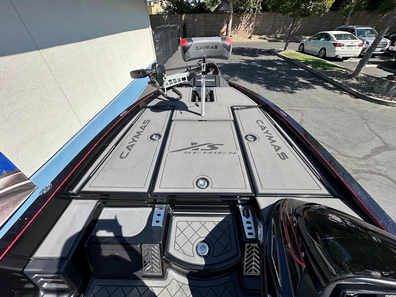 2024 Caymas XS 20 boat deck with storage compartments and seating.