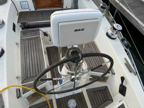 Cockpit of 1974 Nautor Swan 38 sailboat with steering wheel and B&G navigation system.