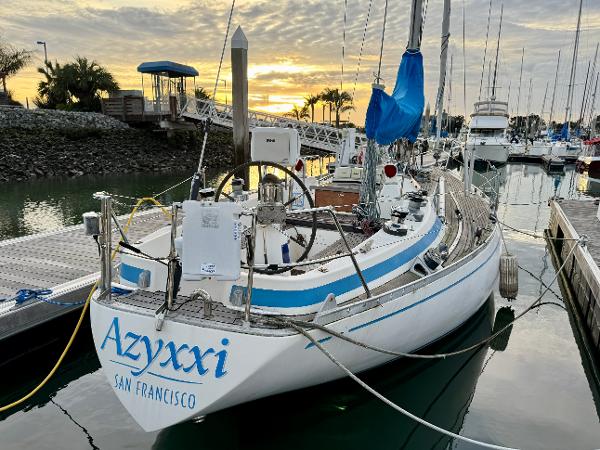 Nautor Swan 38 sailboat docked at sunset, San Francisco marina, 1974 model.