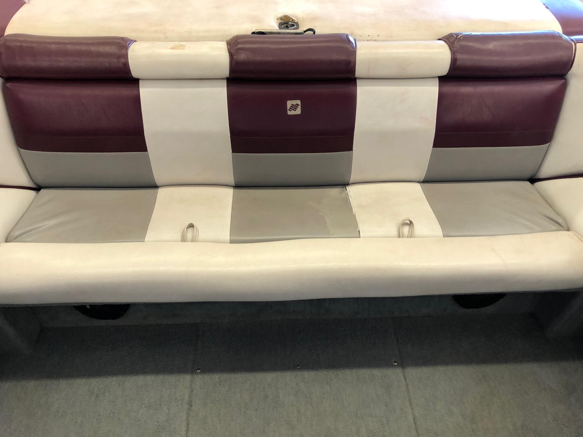 1992 Four Winns 220 Horizon Open Bow boat seat with maroon, white, and gray upholstery.