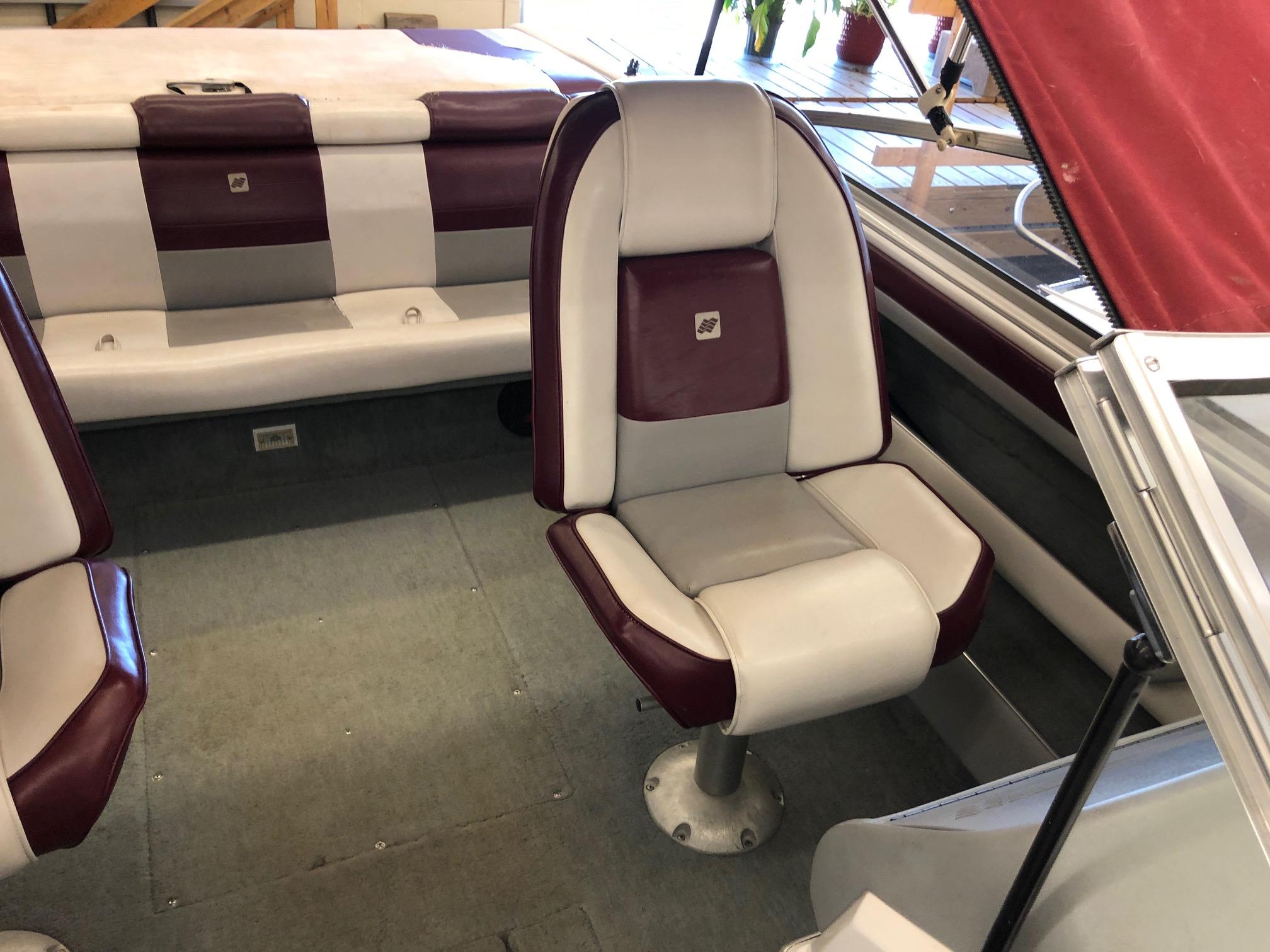 1992 Four Winns 220 Horizon Open Bow boat interior with maroon and white seating.
