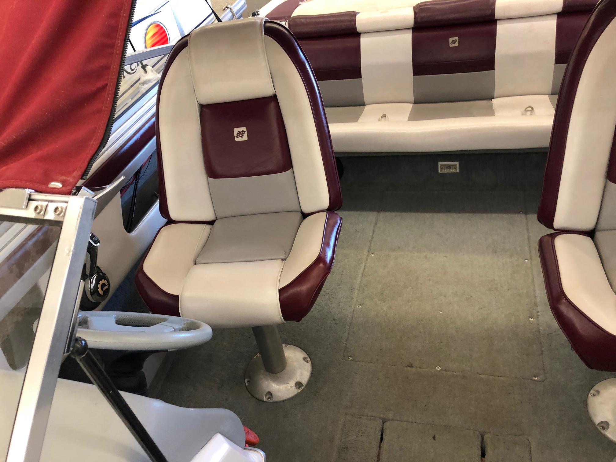1992 Four Winns 220 Horizon Open Bow boat interior with red and white seats.