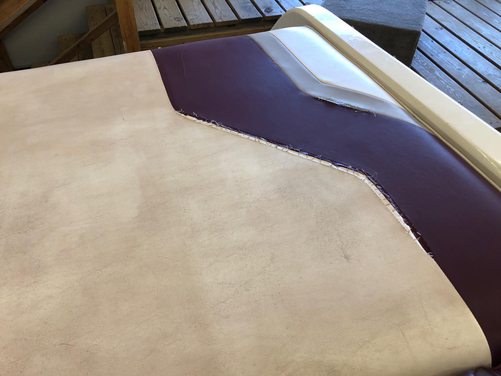 Damaged upholstery on a 1992 Four Winns 220 Horizon Open Bow boat.