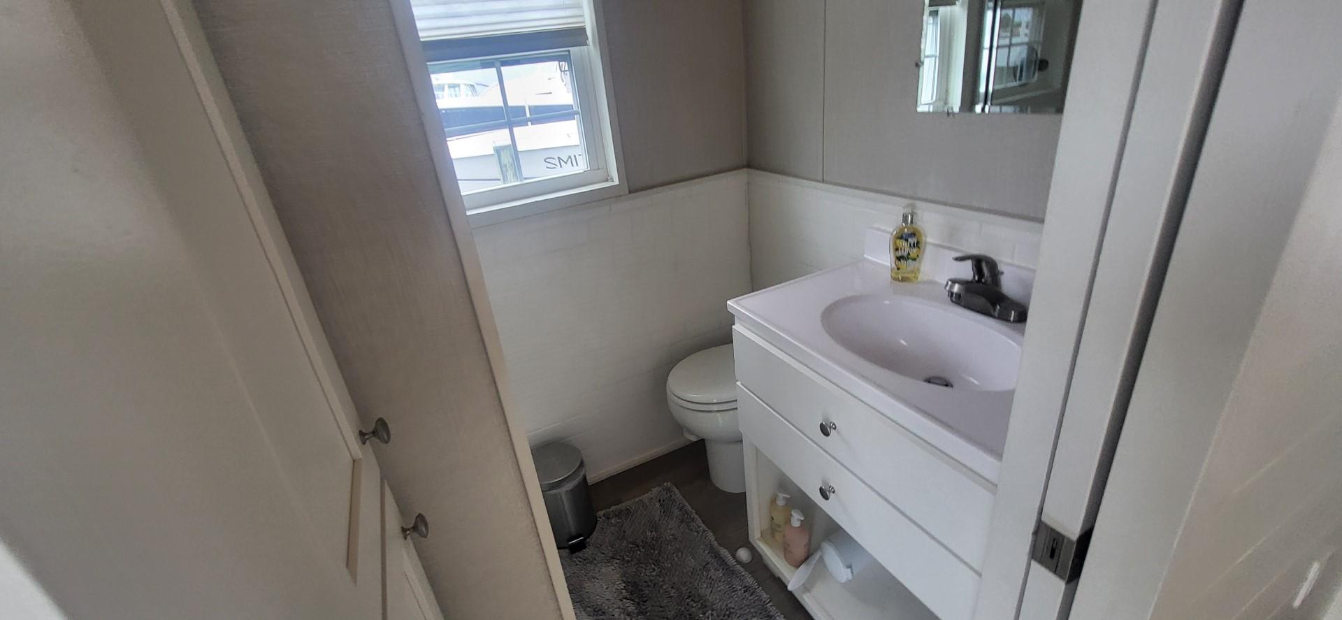 Destination Yachts-16x45 Condo Series 2020 -FL-US-Bathroom interior of 2020 Destination Yachts 16x45 Condo Series, featuring sink and toilet.-9562403 | Thumbnail
