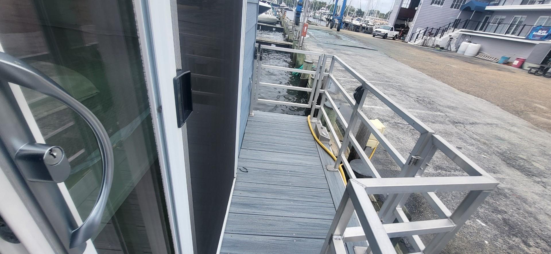 Destination Yachts-16x45 Condo Series 2020 -FL-US-2020 Destination Yachts 16x45 Condo Series docked at marina, side view.-9562403 | Thumbnail