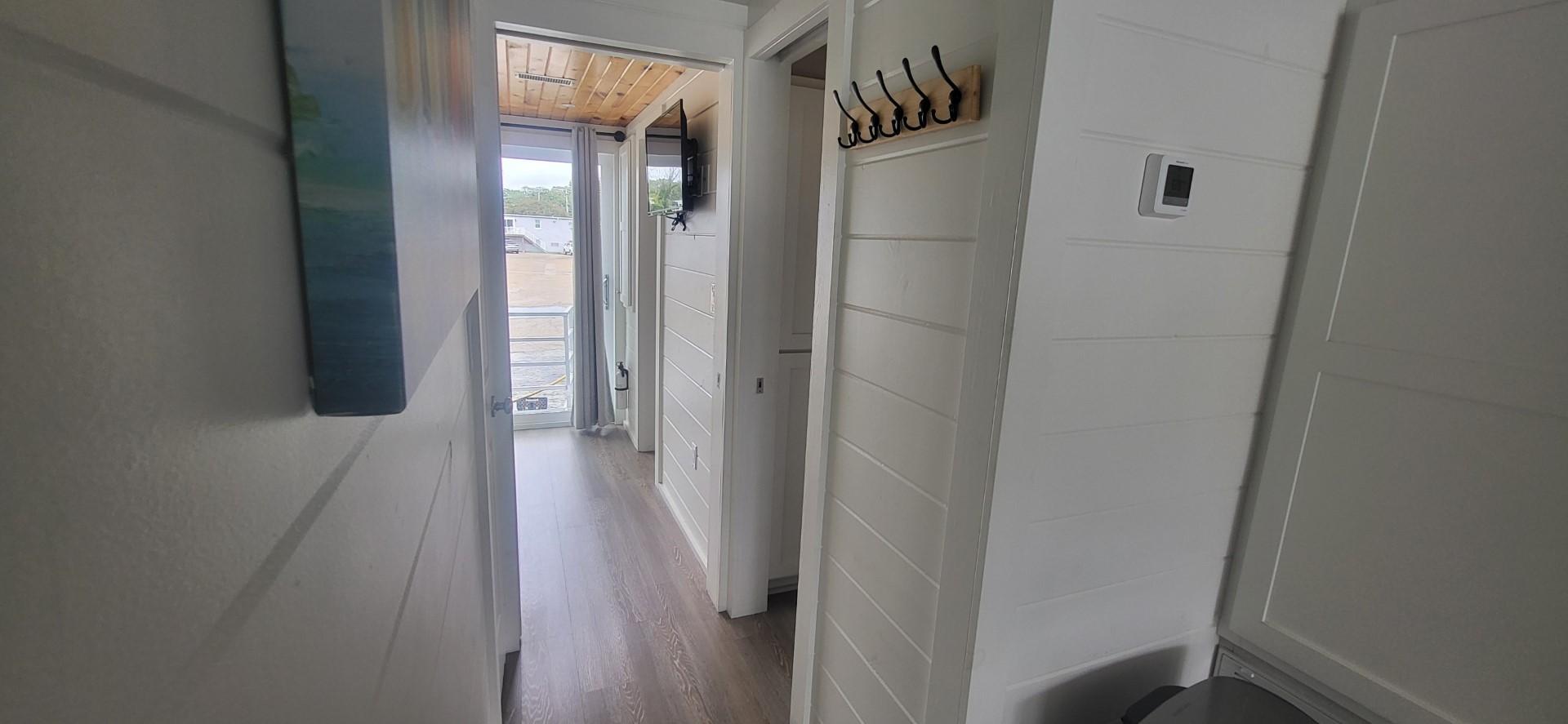 Destination Yachts-16x45 Condo Series 2020 -FL-US-Interior hallway of 2020 Destination Yachts 16x45 Condo Series, featuring modern design and wood flooring.-9562403 | Thumbnail