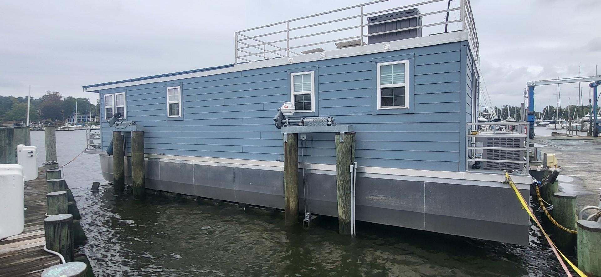 Destination Yachts-16x45 Condo Series 2020 -FL-US-2020 Destination Yachts 16x45 Condo Series houseboat docked at marina.-9562403 | Thumbnail