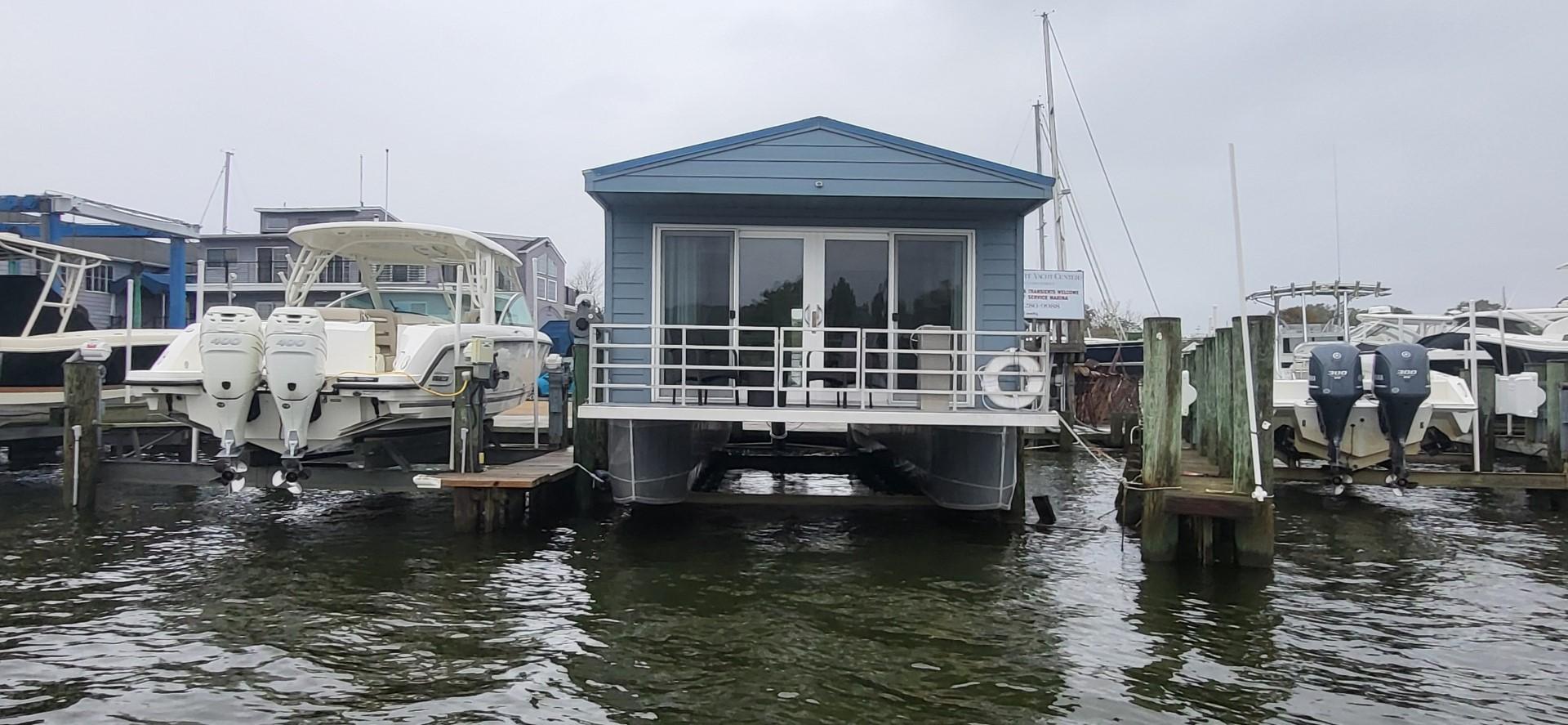 Destination Yachts-16x45 Condo Series 2020 -FL-US-2020 Destination Yachts 16x45 Condo Series houseboat docked at marina.-9562403 | Thumbnail