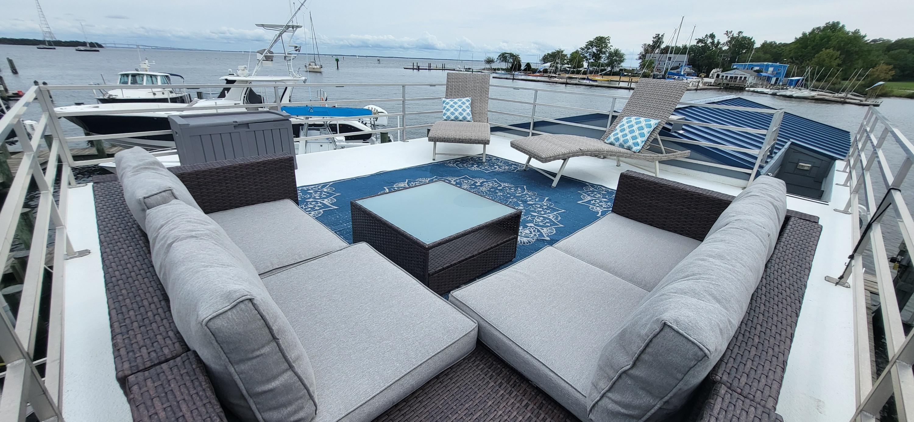 Destination Yachts-16x45 Condo Series 2020 -FL-US-Luxury rooftop deck on 2020 Destination Yachts 16x45 Condo Series, featuring modern outdoor seating.-9562403 | Thumbnail