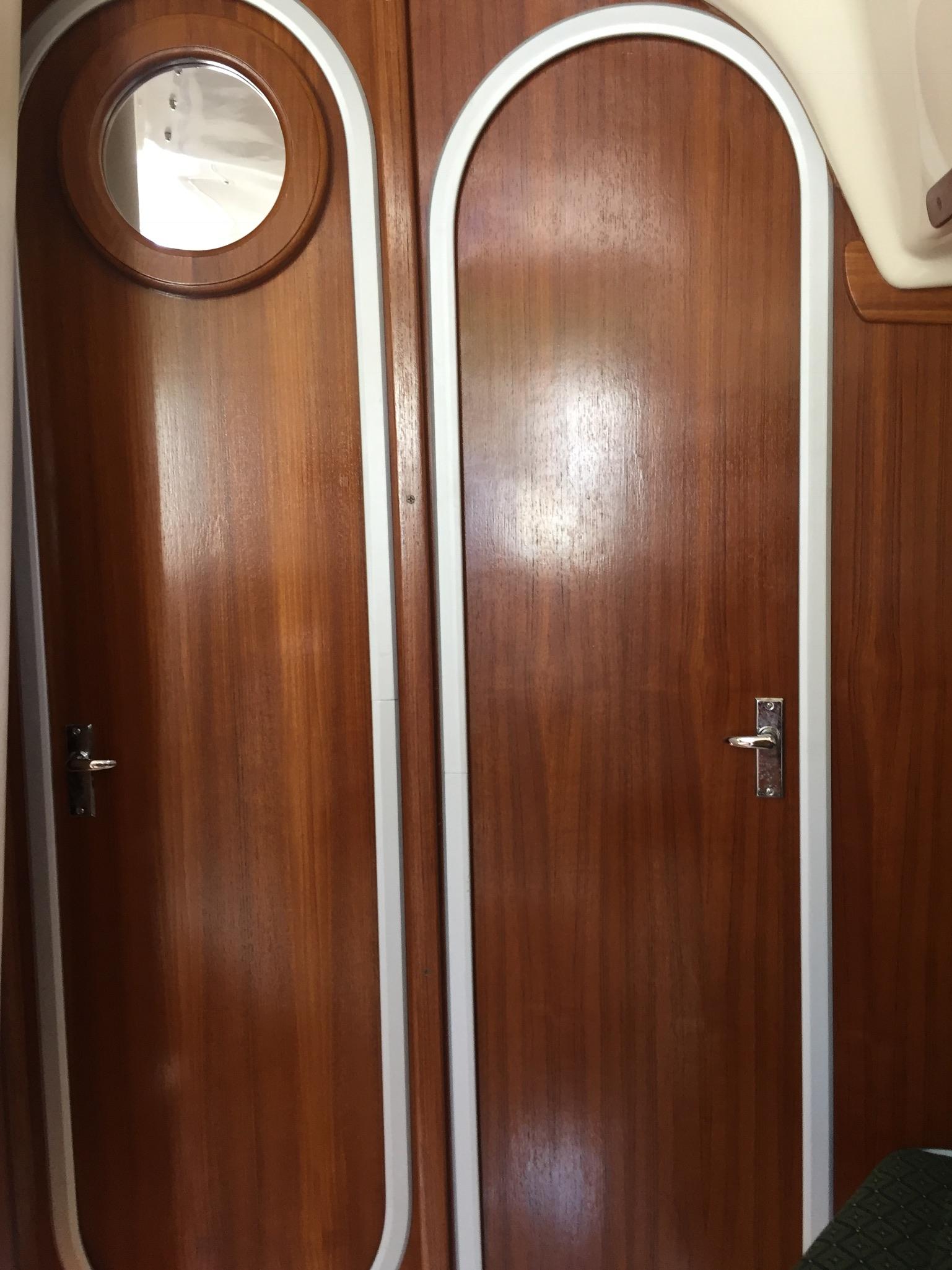 Privacy doors; port to head/stbd to fwd berth