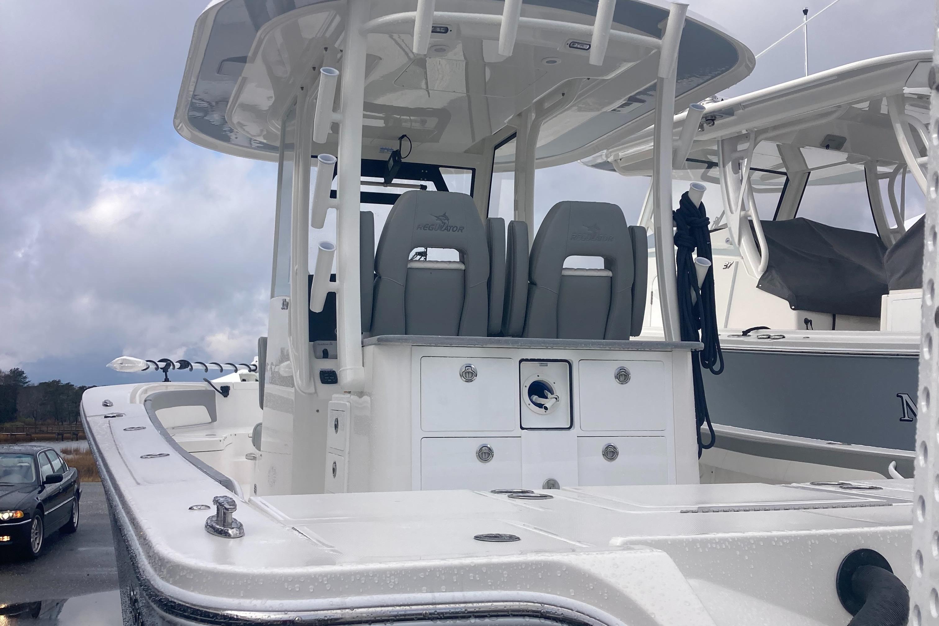 Regulator-30XO 2024-STORM GRAY MA-US-2024 Regulator 30XO boat with dual seats and center console under cloudy sky.-9692464 | Thumbnail
