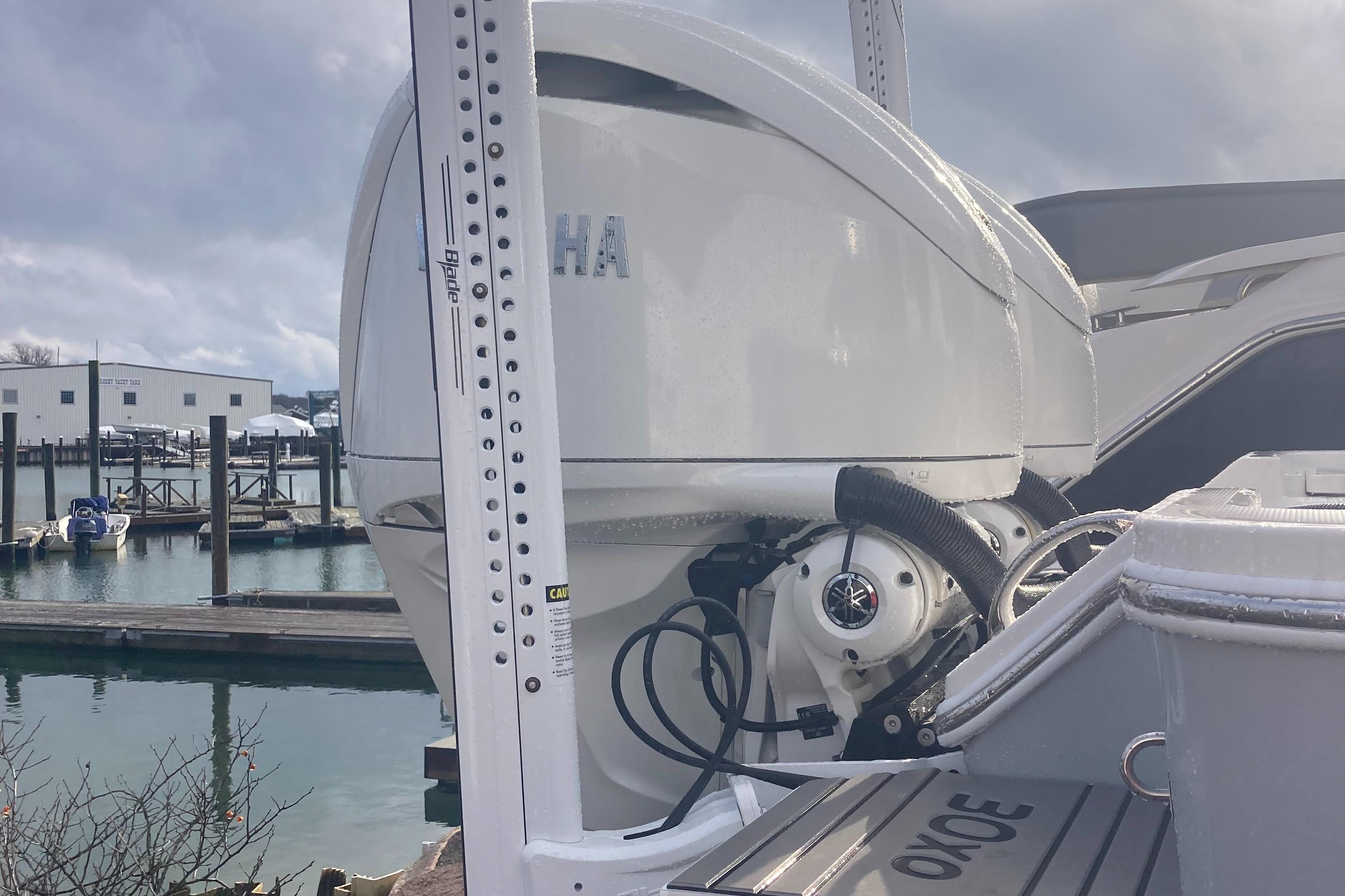 Regulator-30XO 2024-STORM GRAY MA-US-2024 Regulator 30XO boat with Yamaha outboard motor at a marina.-9692464 | Thumbnail