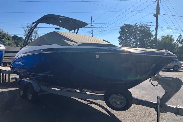 2016 Yamaha AR240 boat on trailer, covered and parked outdoors.