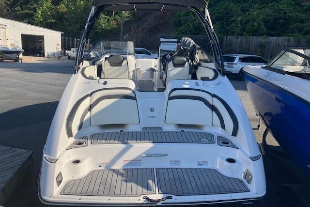 2016 Yamaha Boats AR240, sleek white design, spacious seating, docked outdoors.