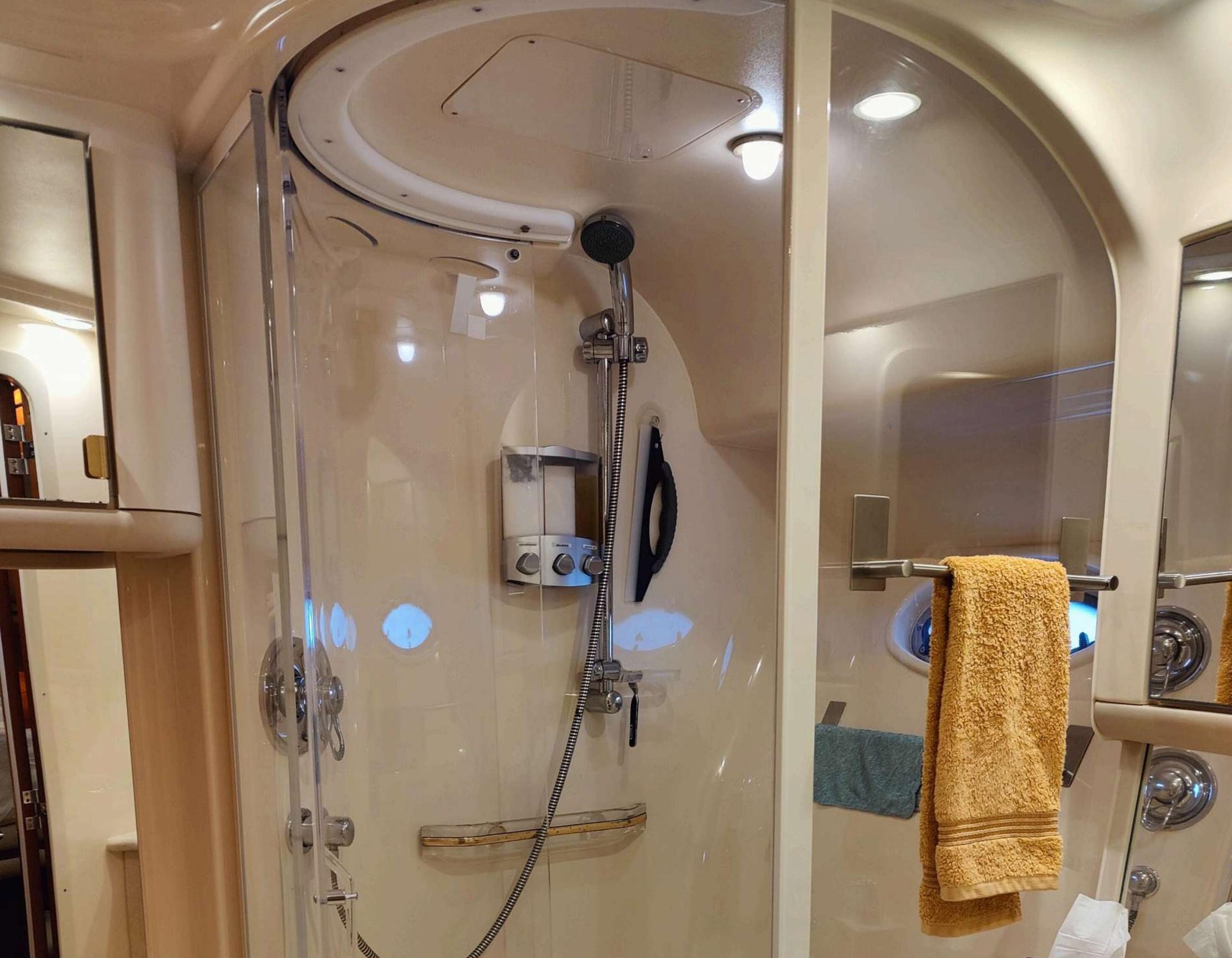 Sea Ray-560 Sedan Bridge 1999-Wade N Winda FL-US-Shower area in 1999 Sea Ray 560 Sedan Bridge yacht with glass door and towel rack.-9842472 | Thumbnail