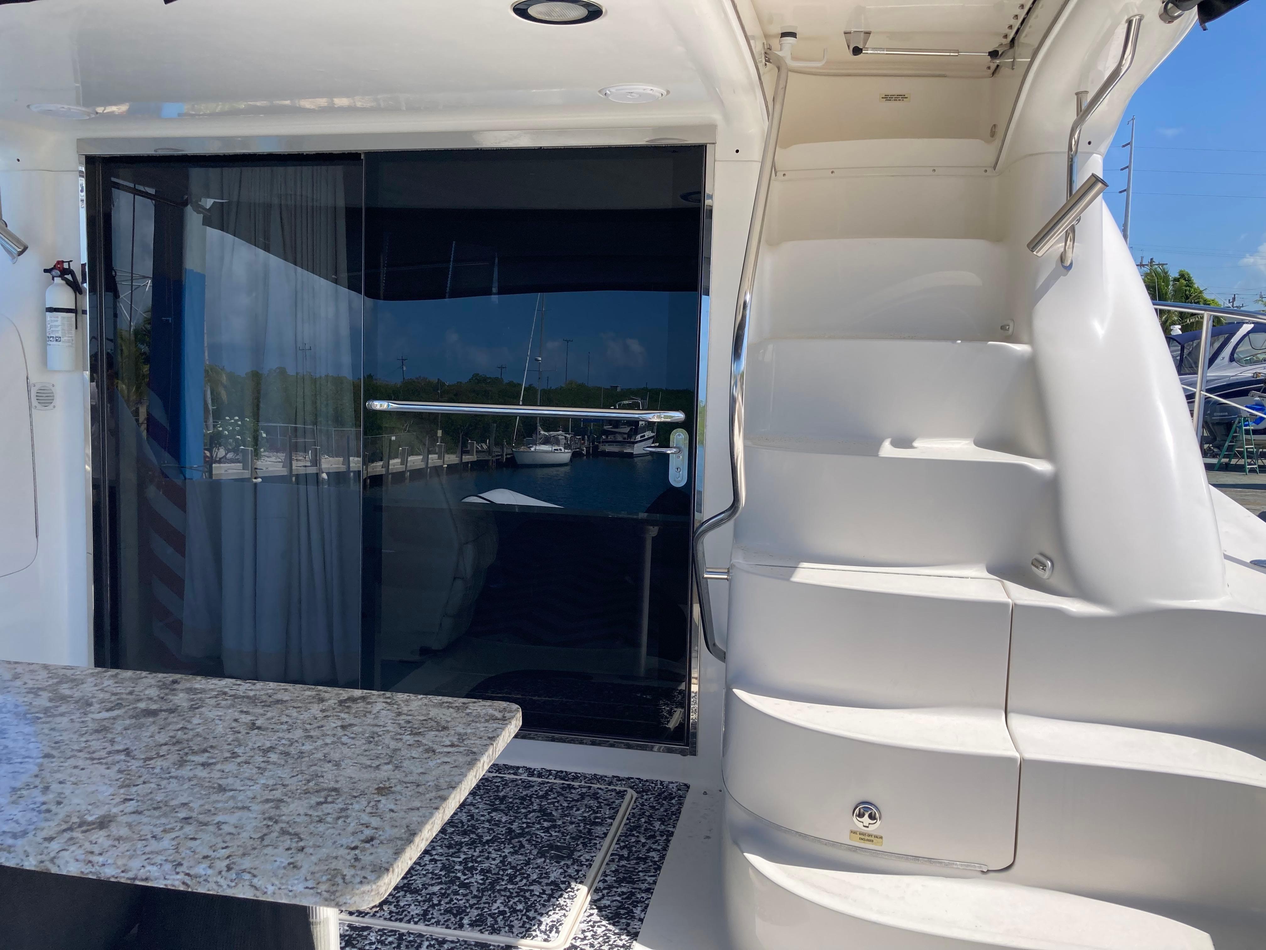 Sea Ray-560 Sedan Bridge 1999-Wade N Winda FL-US-1999 Sea Ray 560 Sedan Bridge yacht with stairs and sliding glass door.-9842472 | Thumbnail