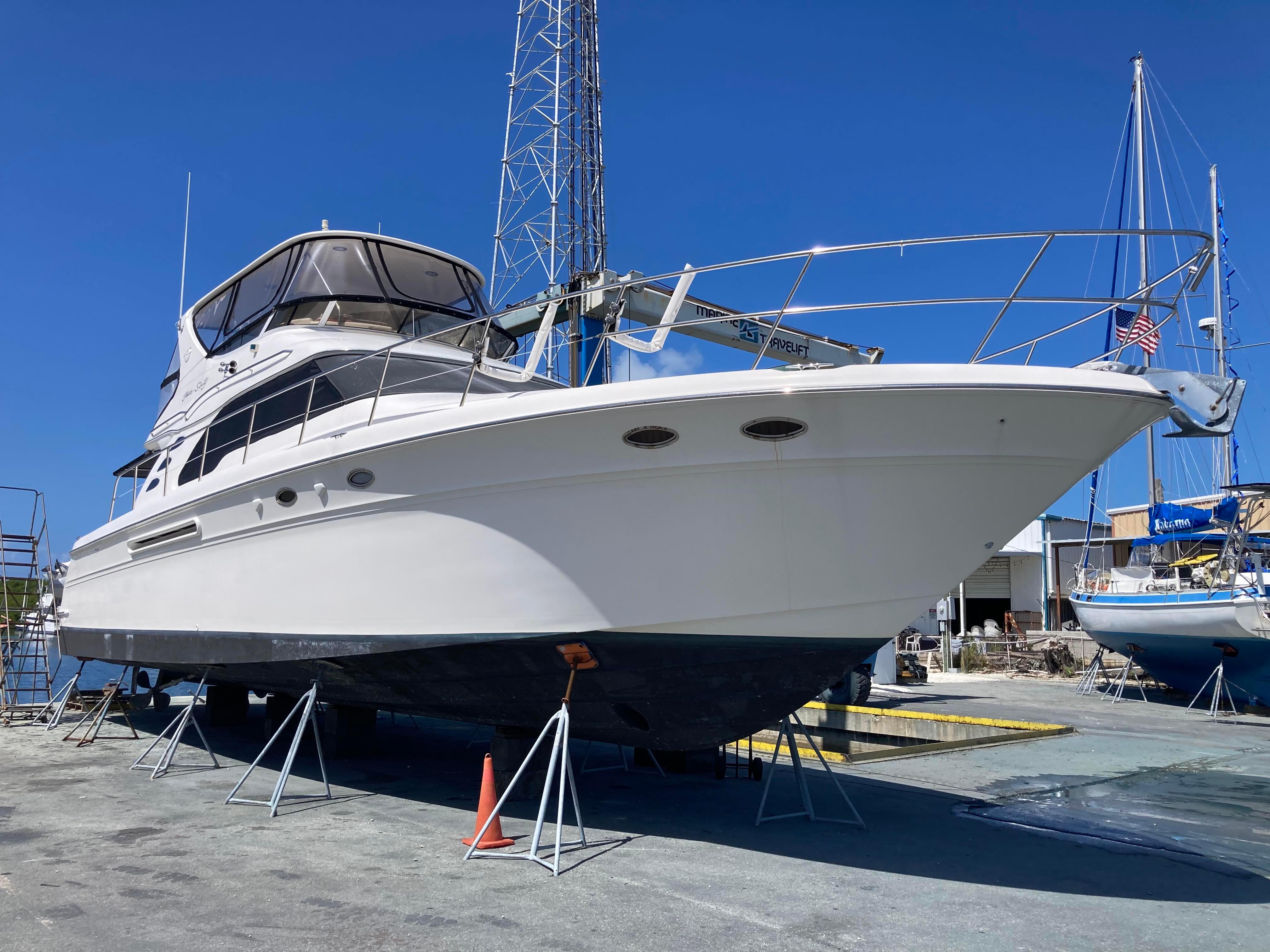 Sea Ray-560 Sedan Bridge 1999-Wade N Winda FL-US-1999 Sea Ray 560 Sedan Bridge yacht on dry dock under clear blue sky.-9842472 | Thumbnail