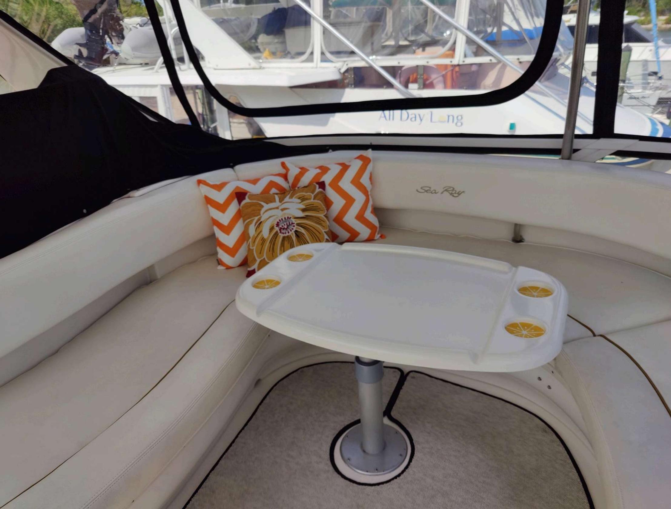 Sea Ray-560 Sedan Bridge 1999-Wade N Winda FL-US-1999 Sea Ray 560 Sedan Bridge interior with cozy seating and decorative pillows.-9842472 | Thumbnail