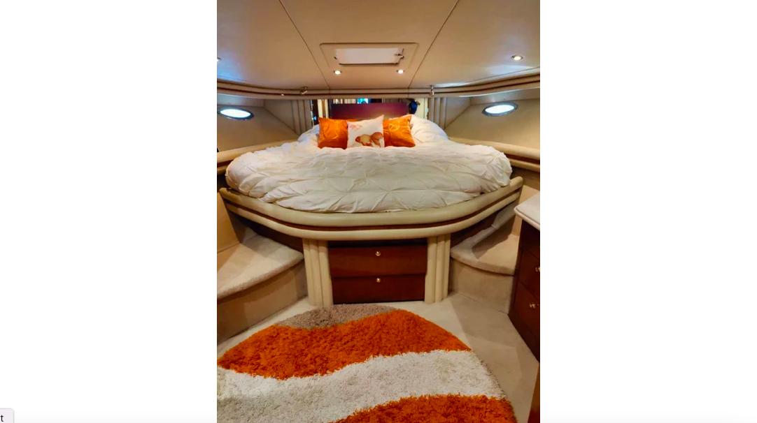 Sea Ray-560 Sedan Bridge 1999-Wade N Winda FL-US-Luxurious 1999 Sea Ray 560 Sedan Bridge bedroom with cozy bedding and vibrant decor.-9842472 | Thumbnail