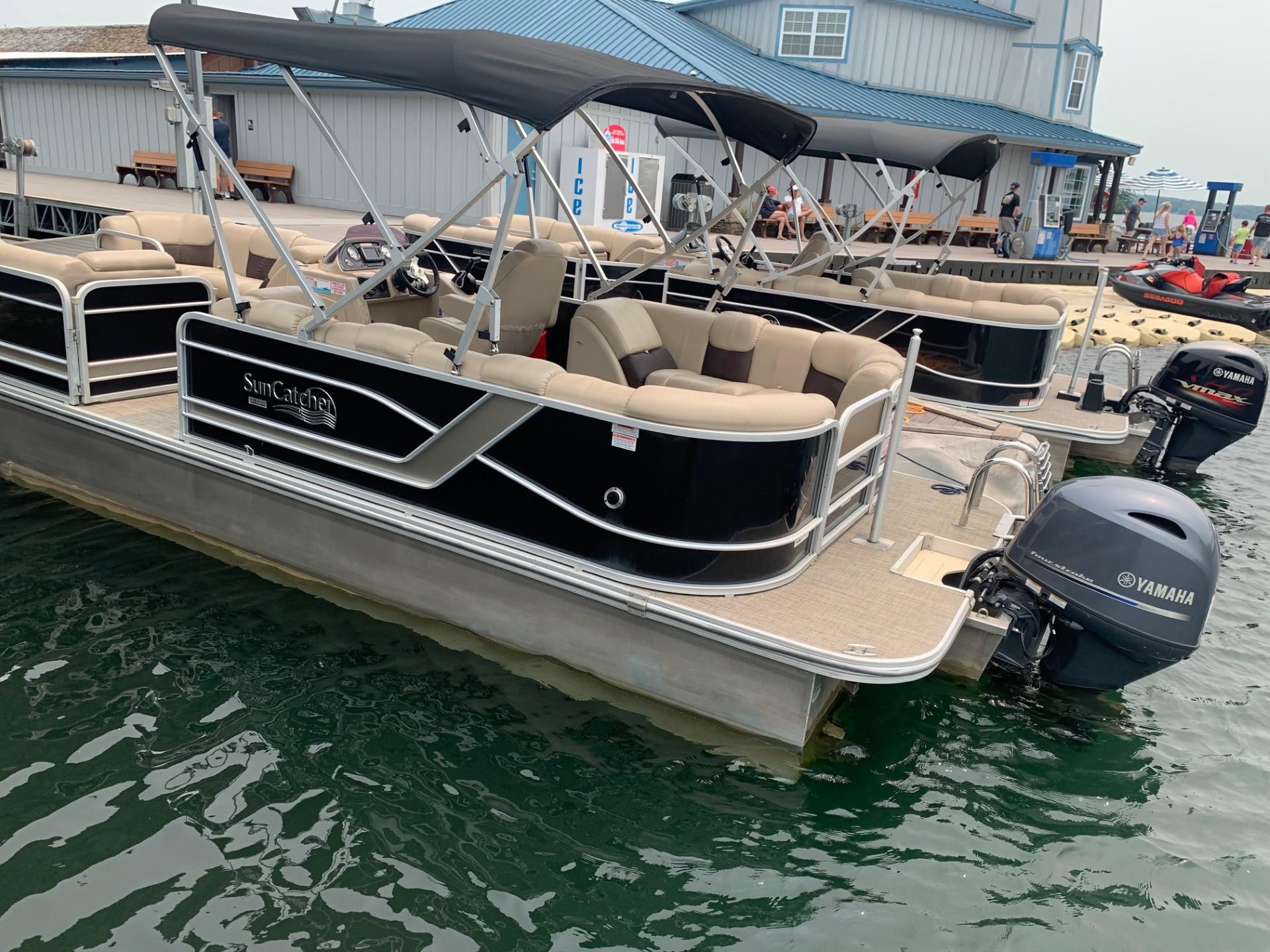 2021 G3 SunCatcher Fusion 325RCX pontoon boat docked with Yamaha outboard motor.