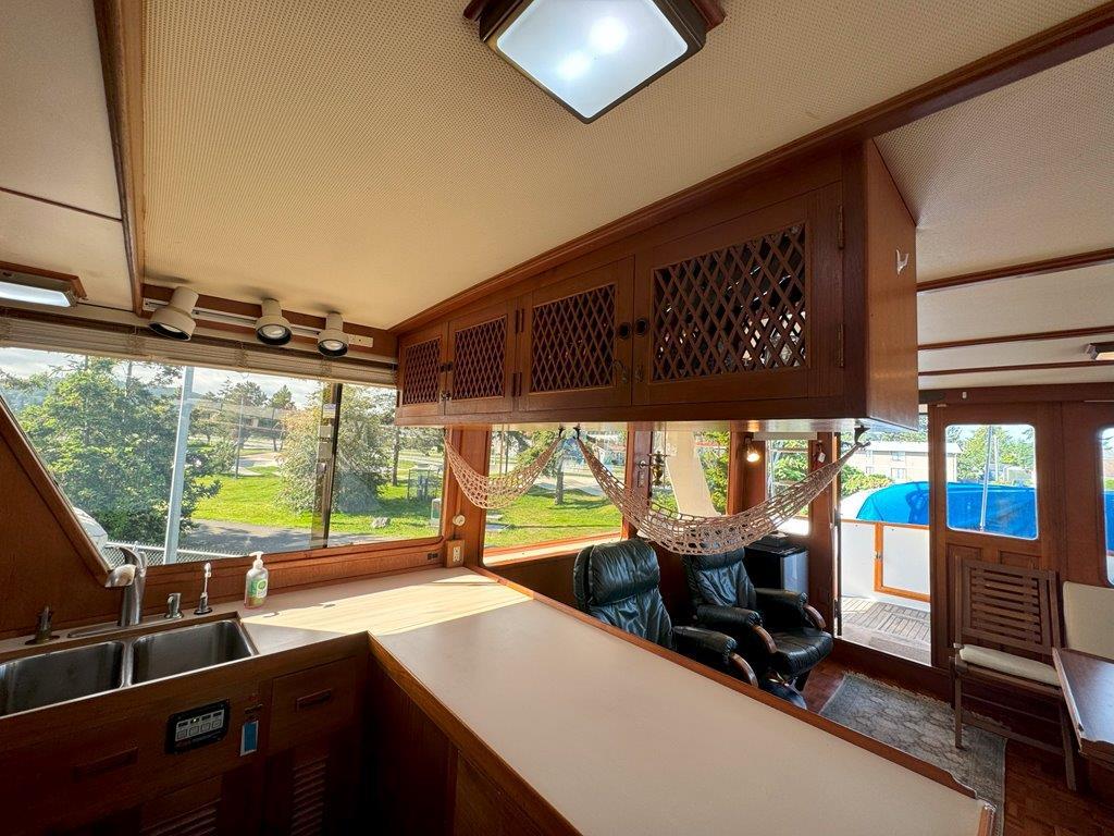 Ocean Alexander-50 MK1 1980 -WA-US-Interior of 1980 Ocean Alexander 50 MK1 yacht with wood cabinetry and large windows.-9725618 | Thumbnail