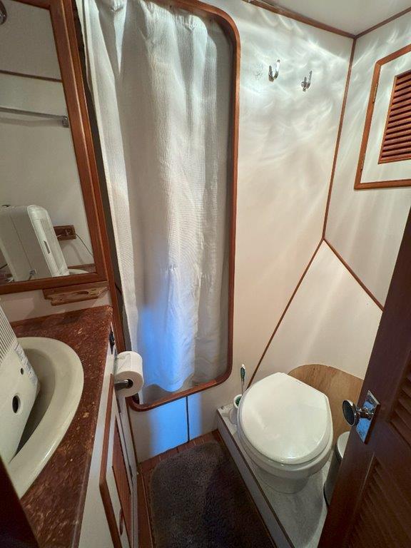 Ocean Alexander-50 MK1 1980 -WA-US-Ocean Alexander 50 MK1 1980 yacht bathroom with shower, sink, and toilet.-9725618 | Thumbnail