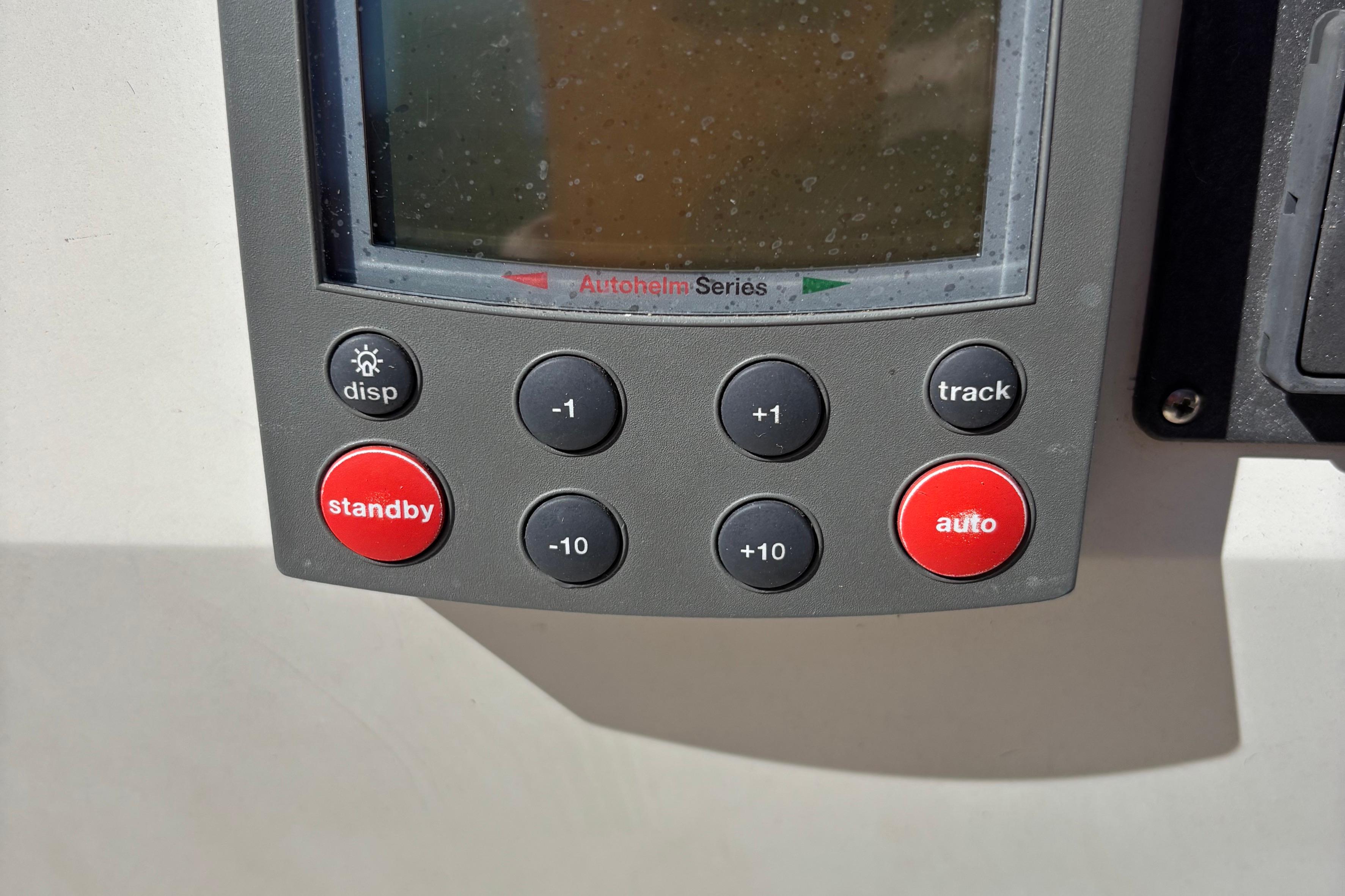 Autopilot control panel on a 1981 O'Day 34 sailboat, featuring various function buttons.