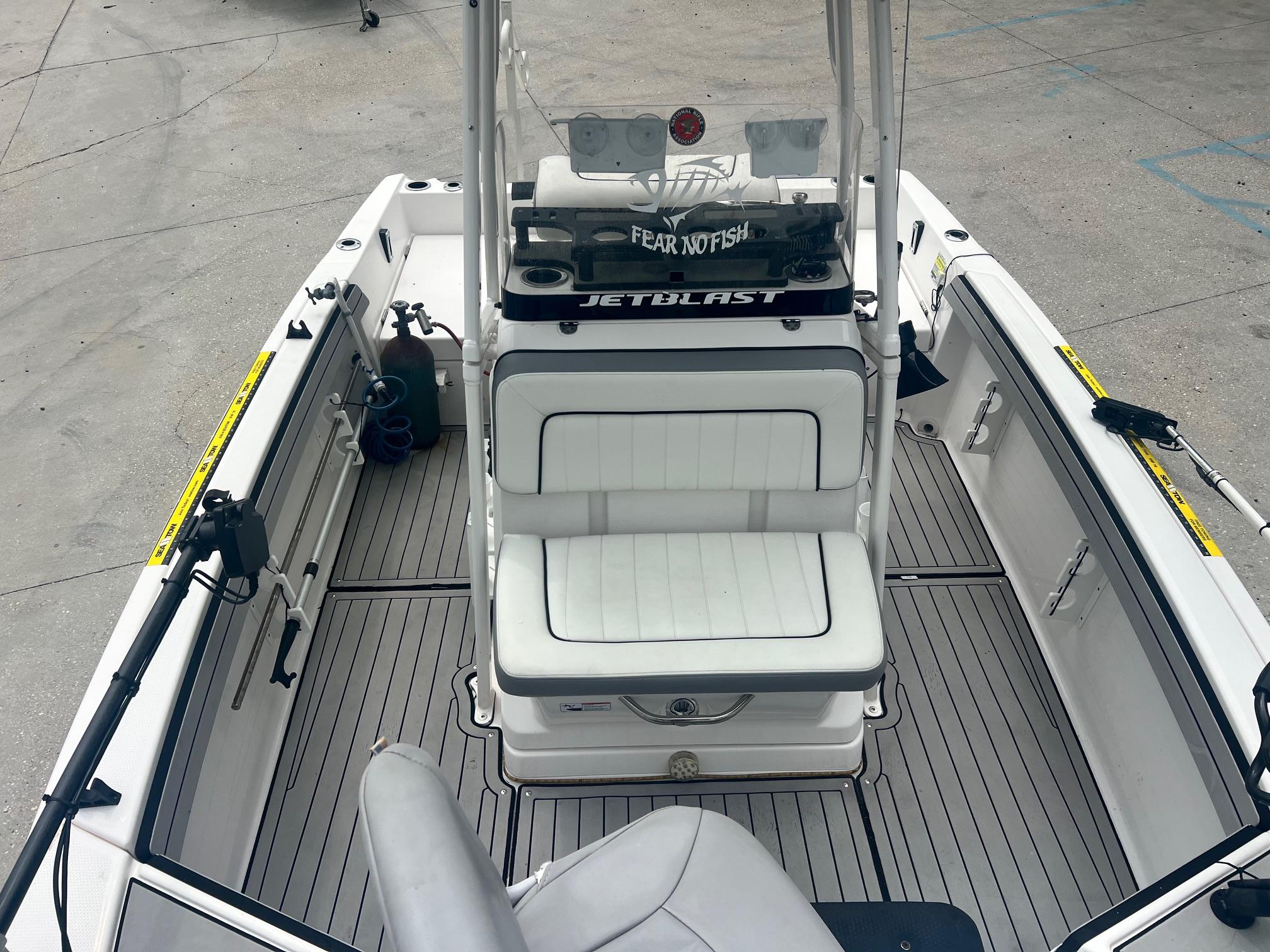 2020 Yamaha Boats 195 FSH Sport interior with seating and fishing equipment.