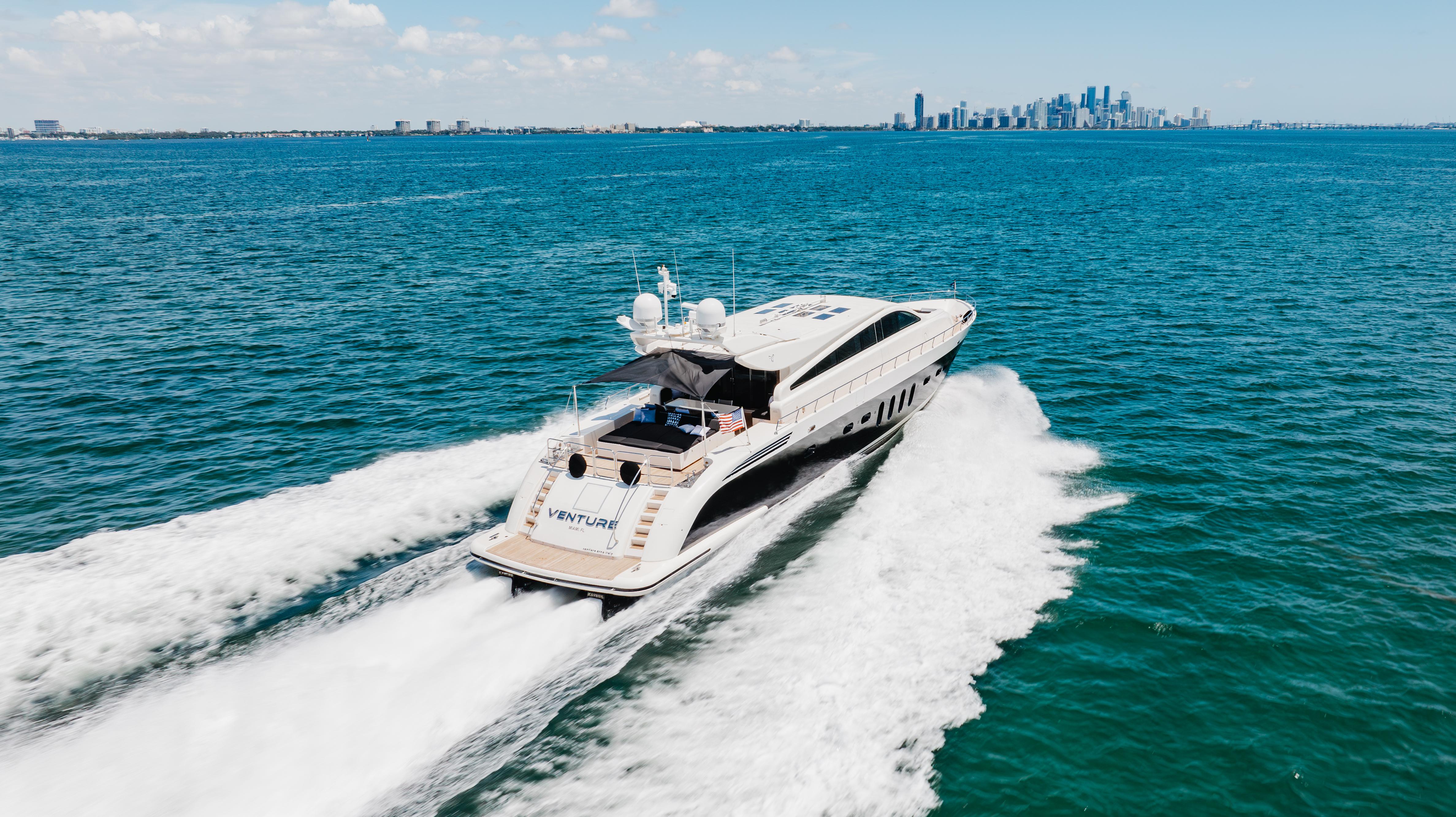 Leopard-Cantiere Navale Arno SpA 2007-VENTURE FL-US-Luxury Leopard yacht cruising on open sea, city skyline in background, 2007 model.-9232651 | Thumbnail