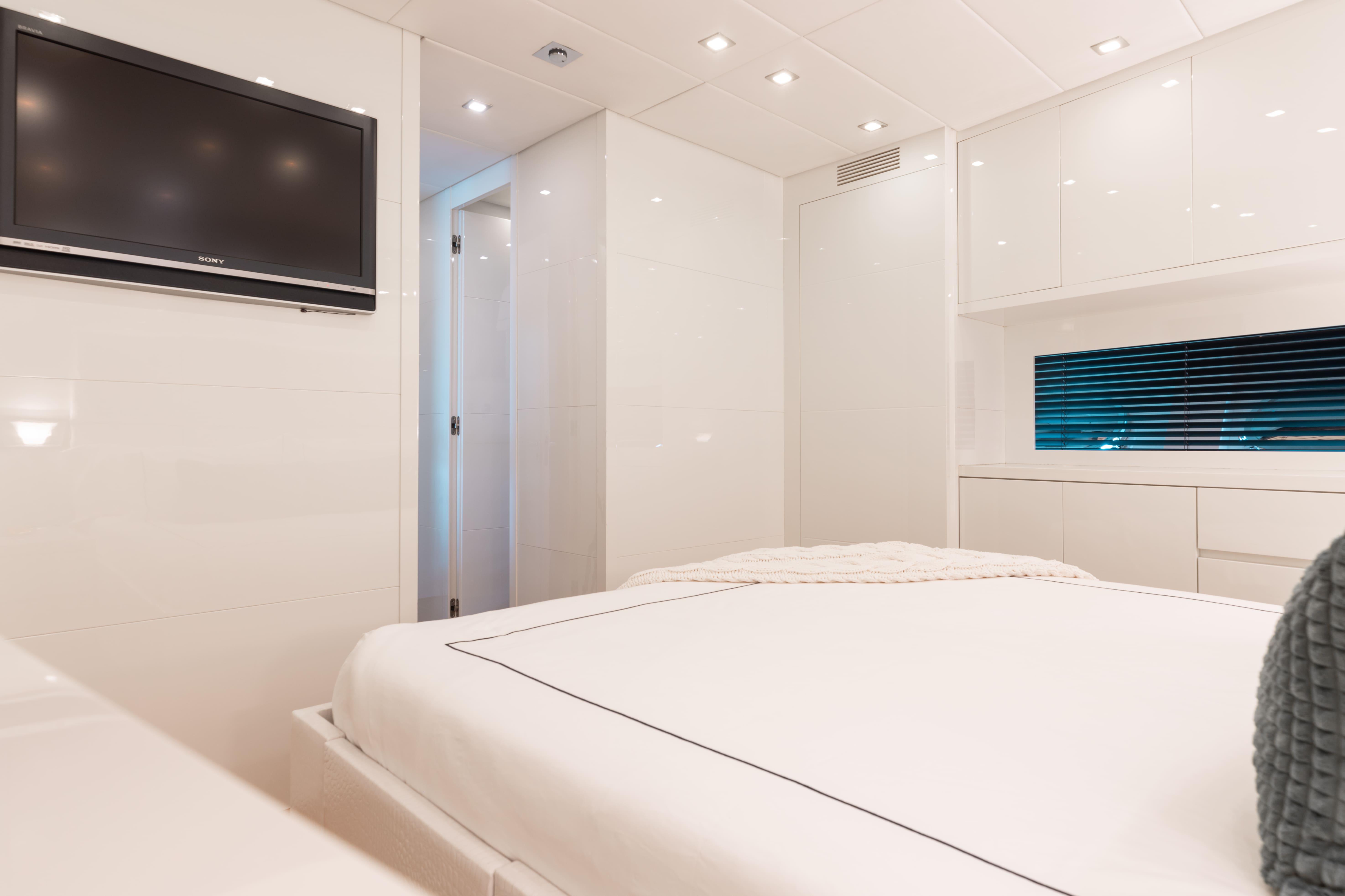 Leopard-Cantiere Navale Arno SpA 2007-VENTURE FL-US-Luxurious yacht bedroom with modern decor, flat-screen TV, and ambient lighting, Leopard Cantiere Navale Arno SpA 2007.-9232651 | Thumbnail
