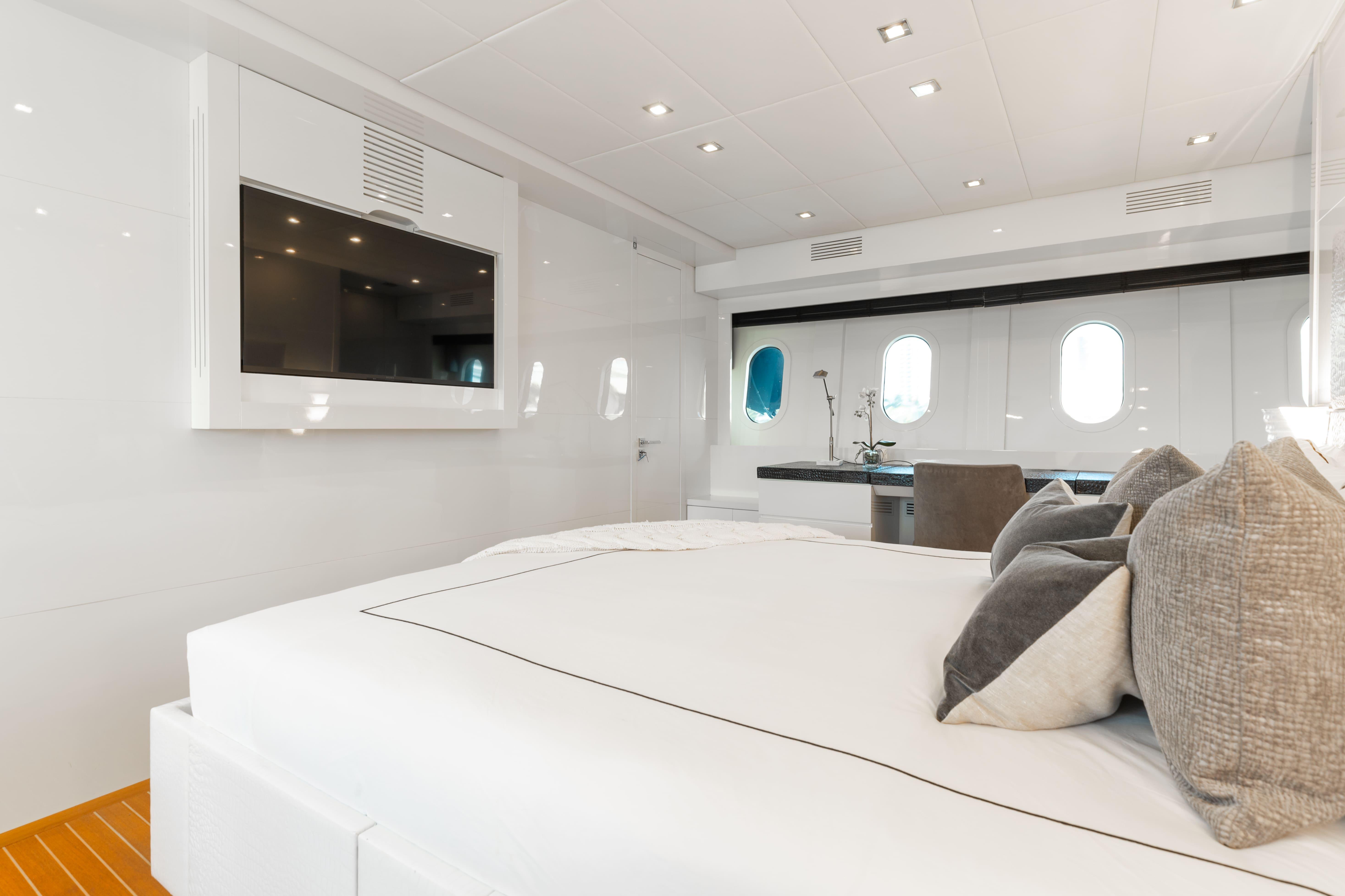 Leopard-Cantiere Navale Arno SpA 2007-VENTURE FL-US-Luxurious yacht bedroom interior with modern decor, featuring a large bed and wall-mounted TV.-9232651 | Thumbnail