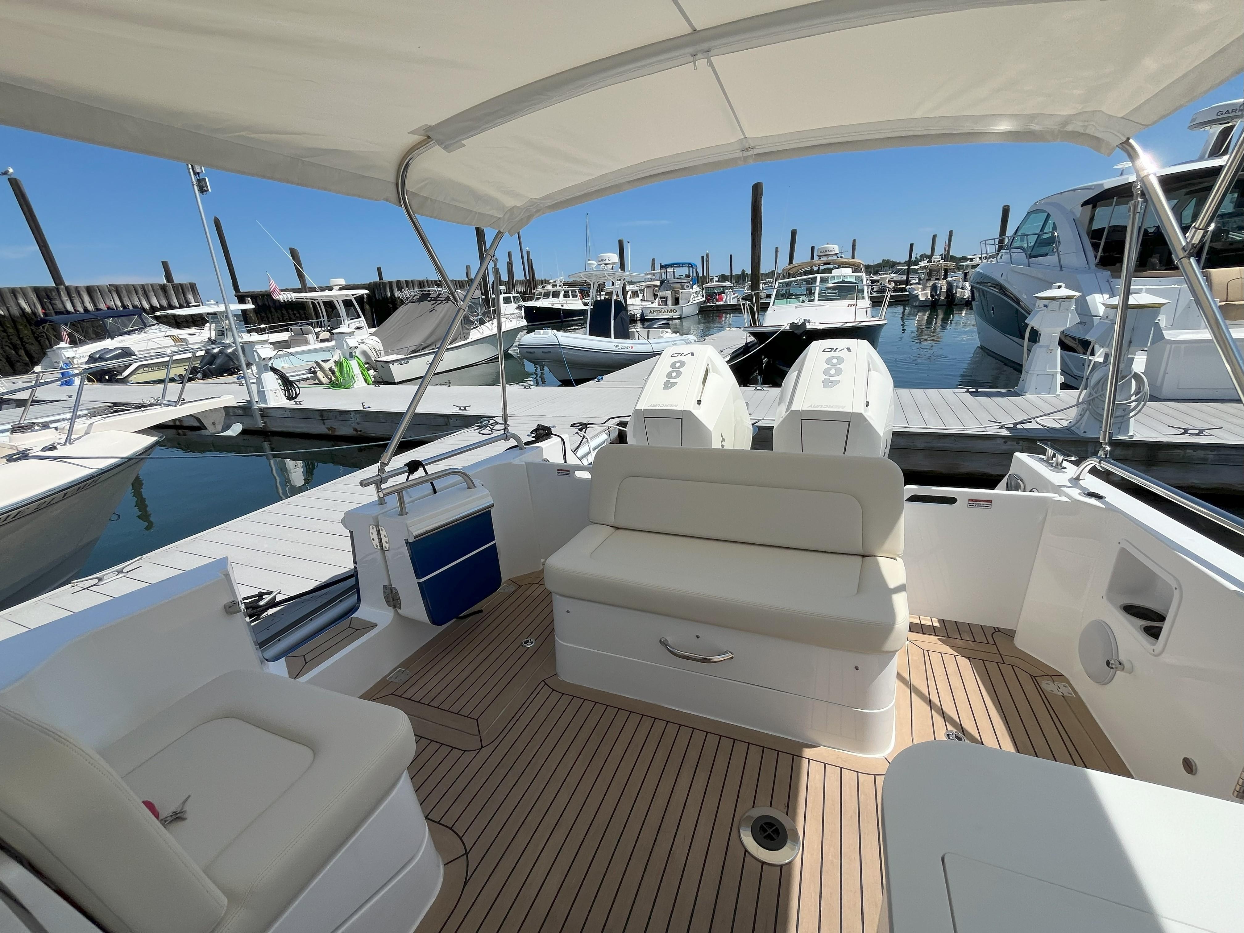 2024 MJM 35 boat interior at marina, featuring comfortable seating and modern design.