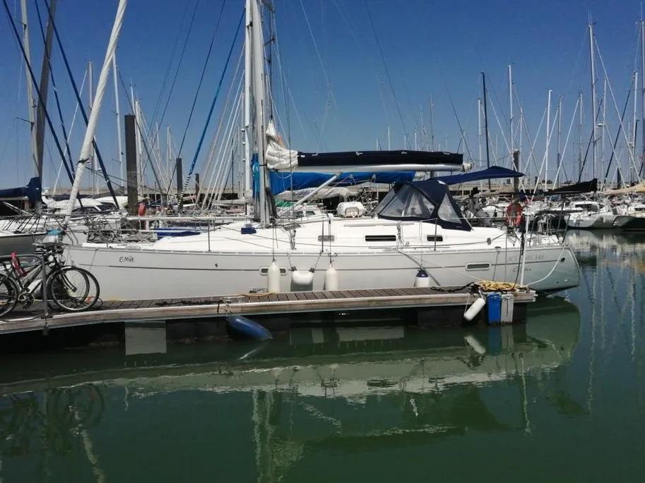 2008 Beneteau Oceanis Clipper 343 sailboat docked in a marina, surrounded by other boats.