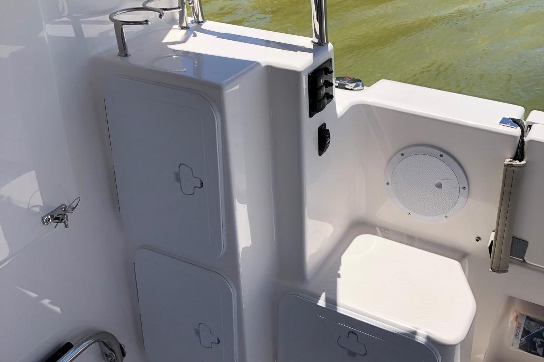 Cutwater-C-32 CB 2025-C32 CB 2025 FL-US-2025 Cutwater C-32 CB boat interior with storage compartments and speaker.-9832181 | Thumbnail