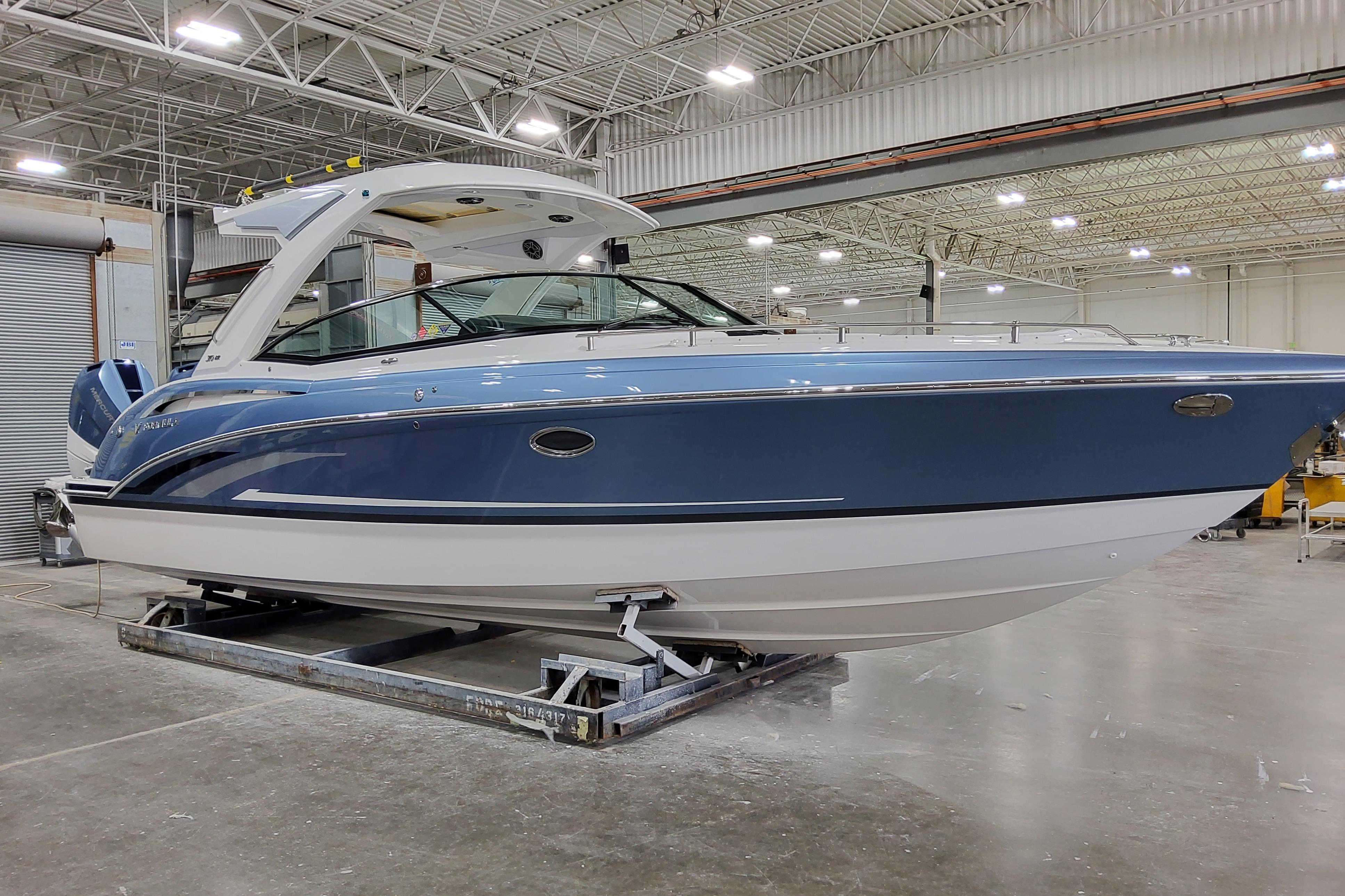 2026 Formula 310 Bowrider OB in a showroom, showcasing sleek design and modern features.