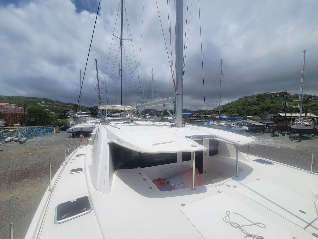 Leopard-44 2015-Kitten Caboodle SC-US-2015 Leopard 44 catamaran docked, showcasing sleek design and spacious deck under cloudy skies.-9762818 | Thumbnail