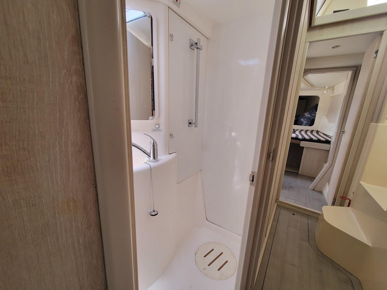 Leopard-44 2015-Kitten Caboodle SC-US-Compact bathroom in 2015 Leopard 44 yacht, featuring shower and sink.-9762818 | Thumbnail